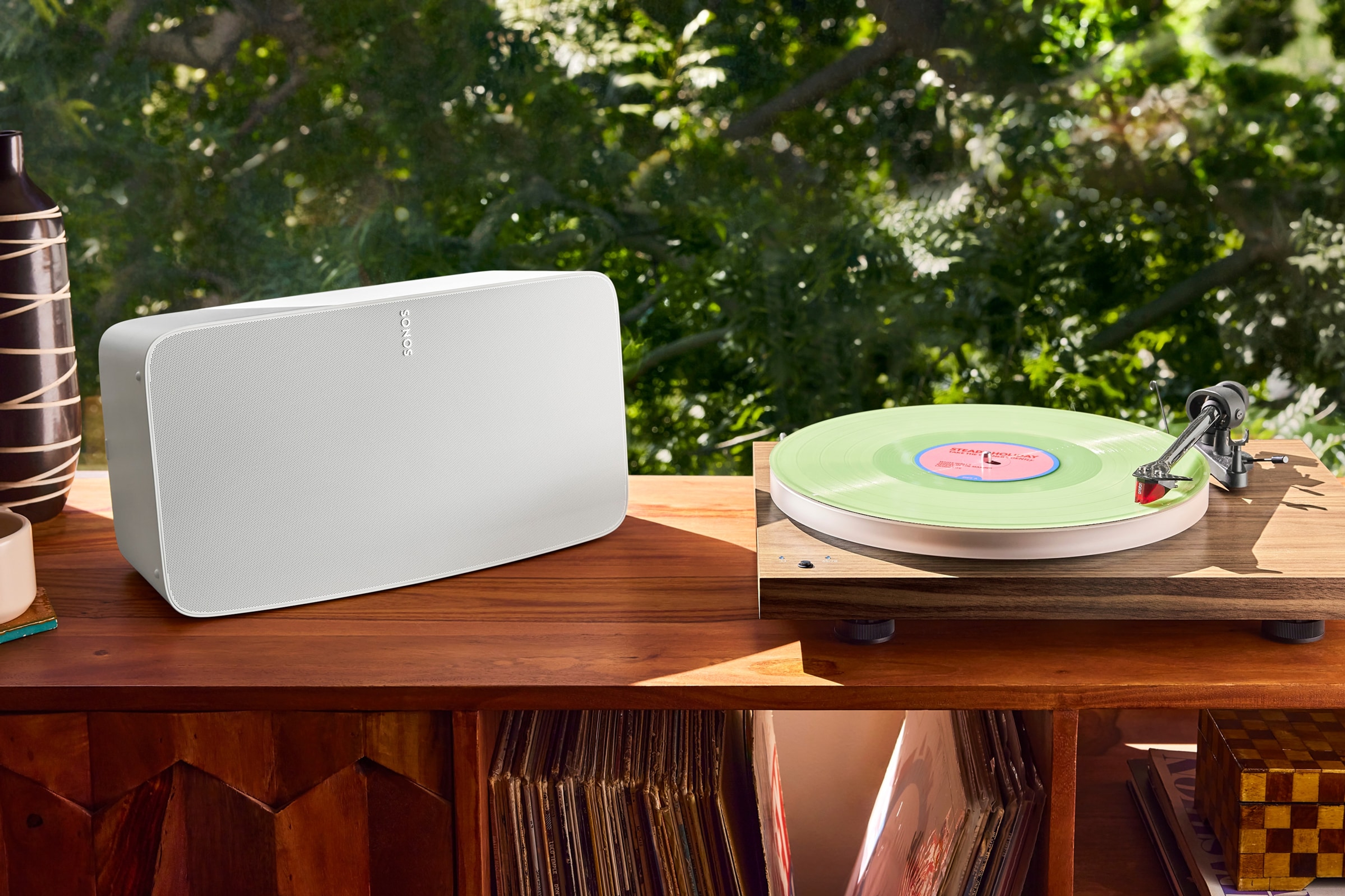 White Sonos Five next to a vinyl turn table