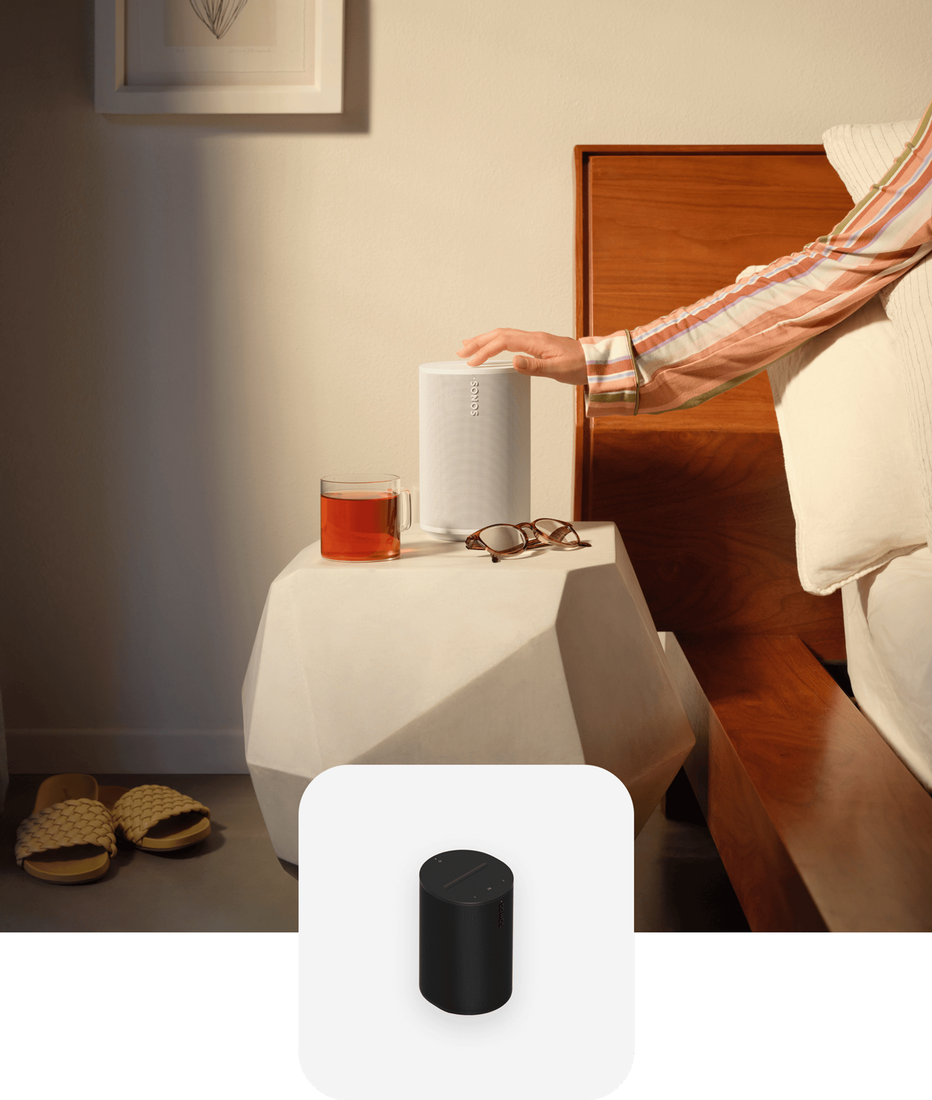 Hand touching a white Era 100 on a bedside table with black Era 100 product tile overlay