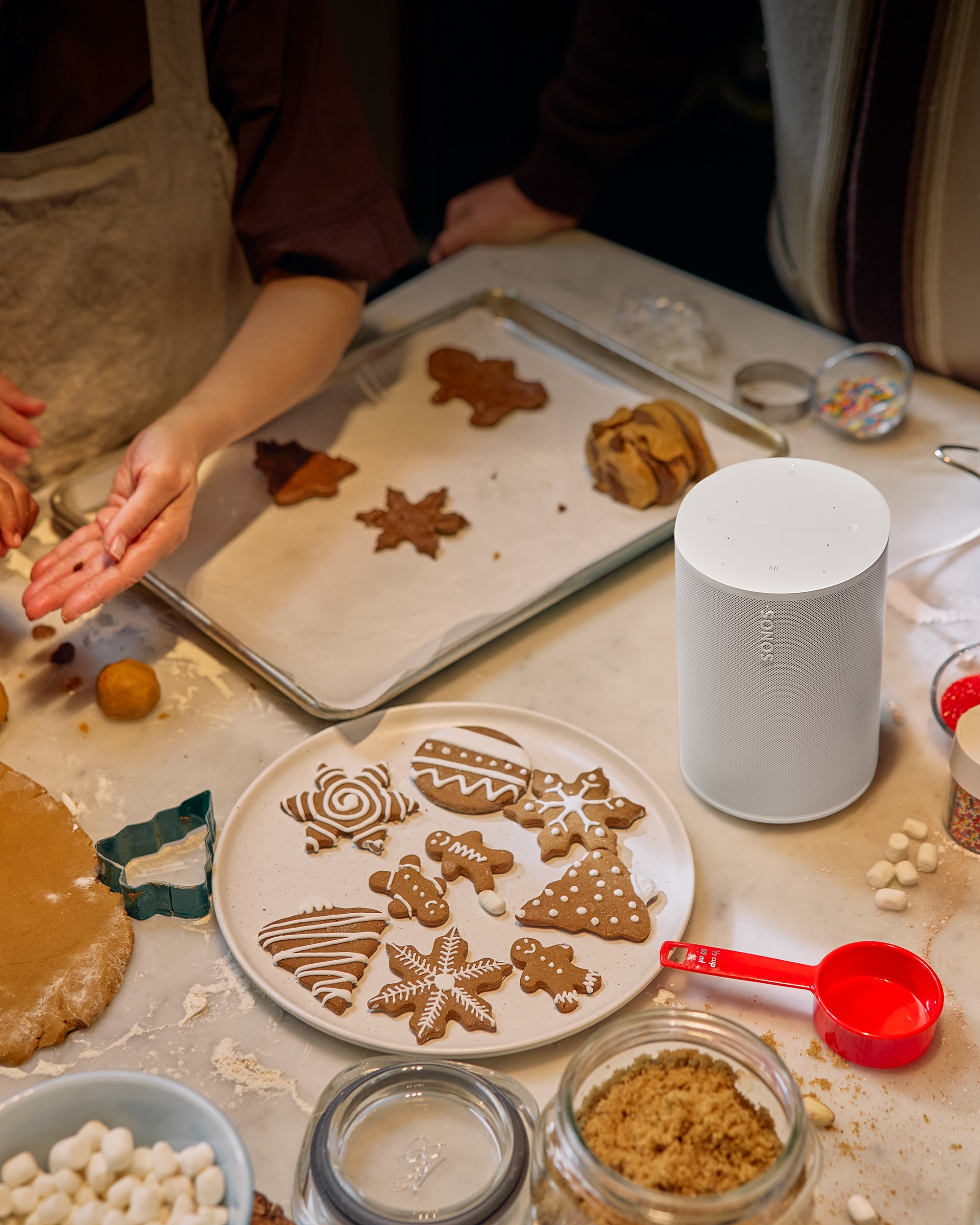 Family baking holiday cookies with a white Era 100