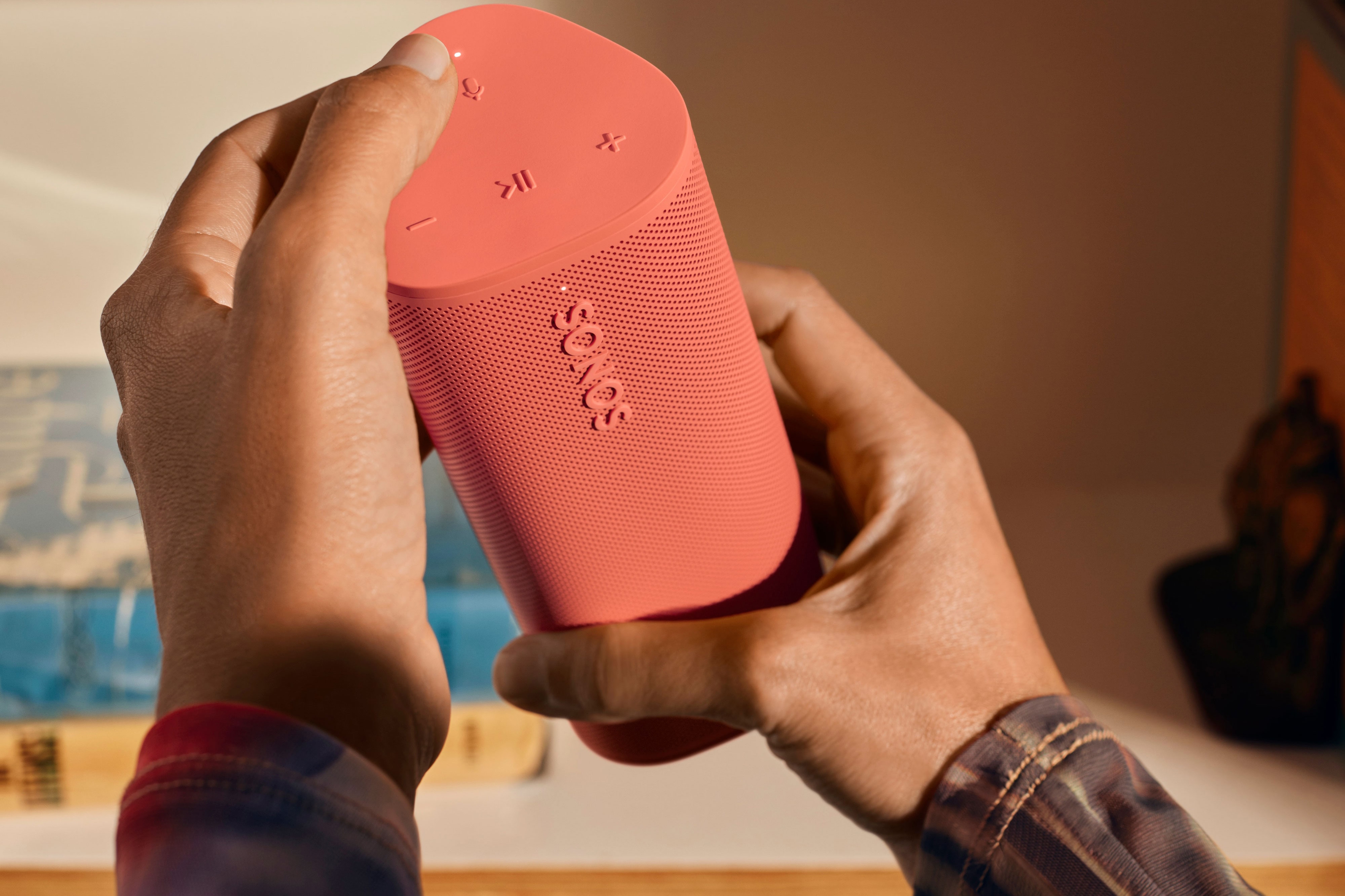 Roam 2 Sunset closeup buttons with hand