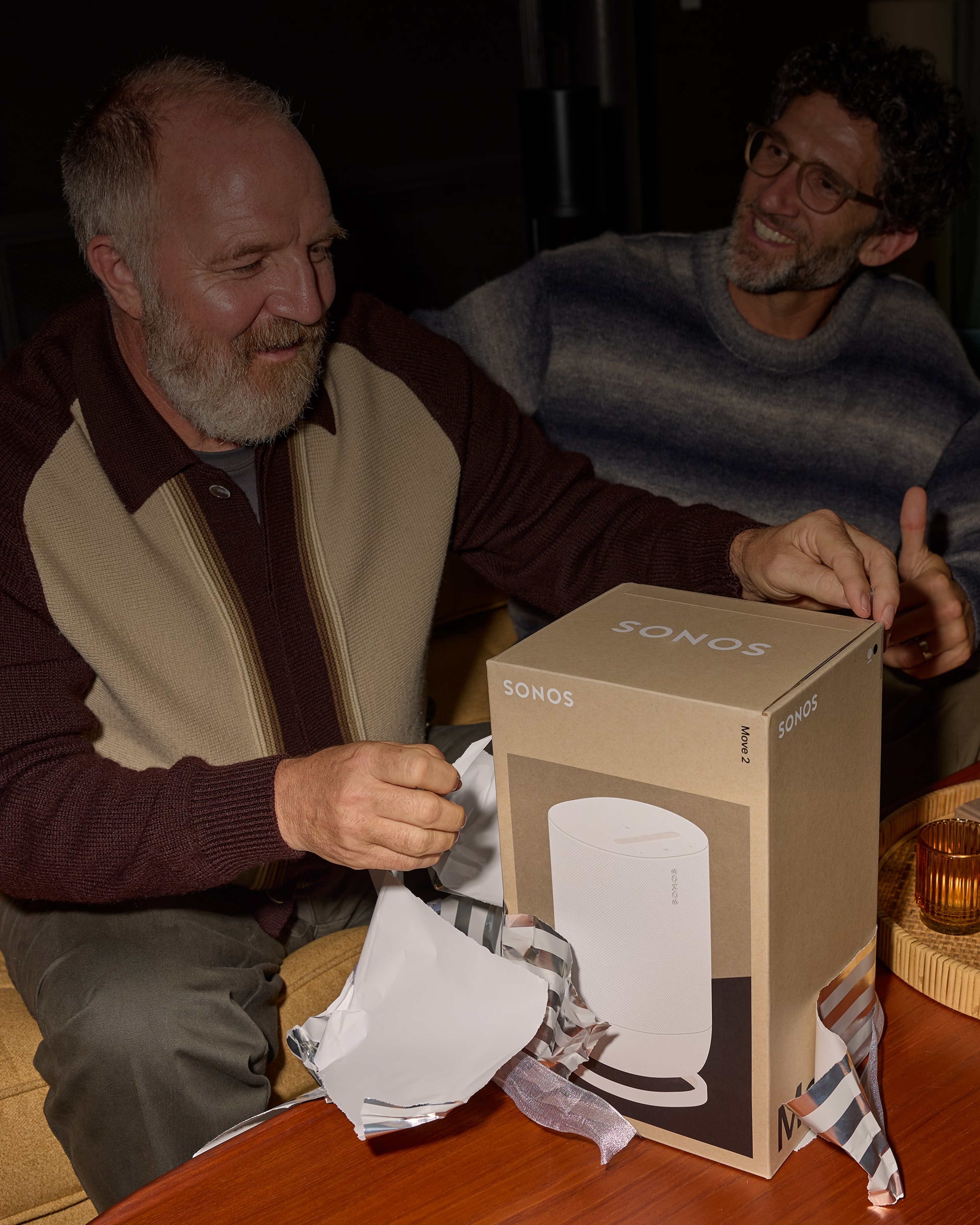 Person unwrapping a white Move 2