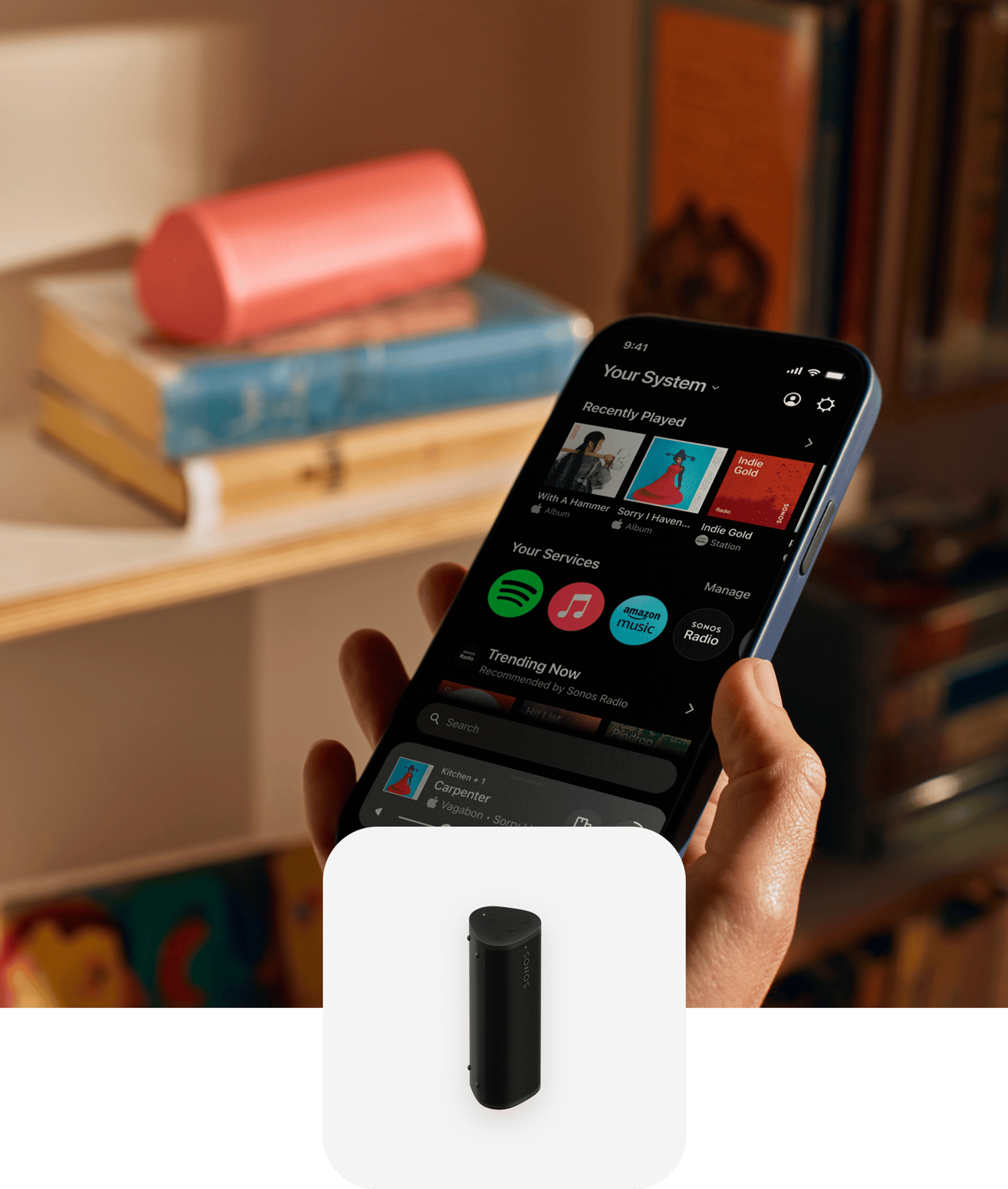 User with their phone using the Sonos app to control a Roam 2 speaker