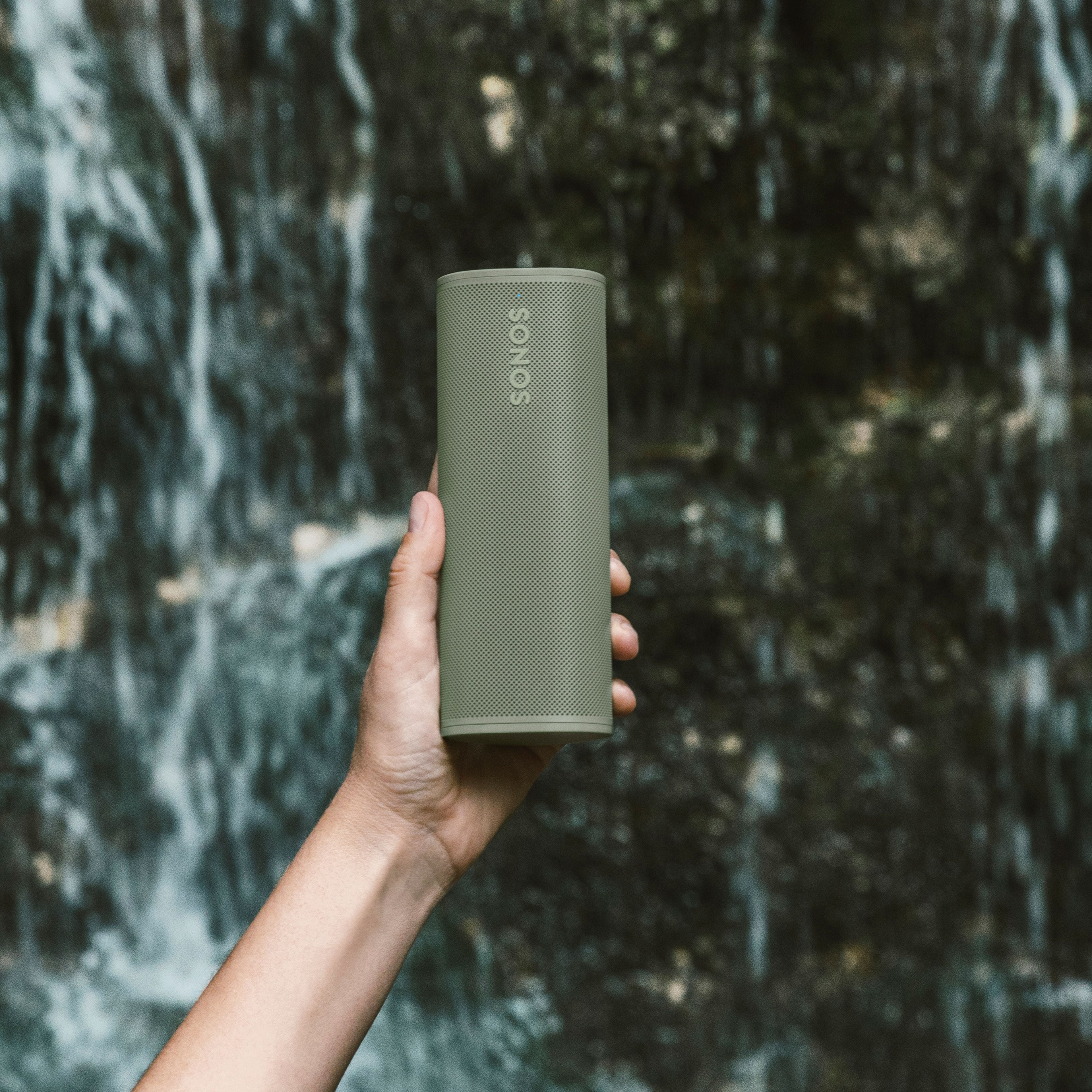 Roam 2 Olive with waterfall background