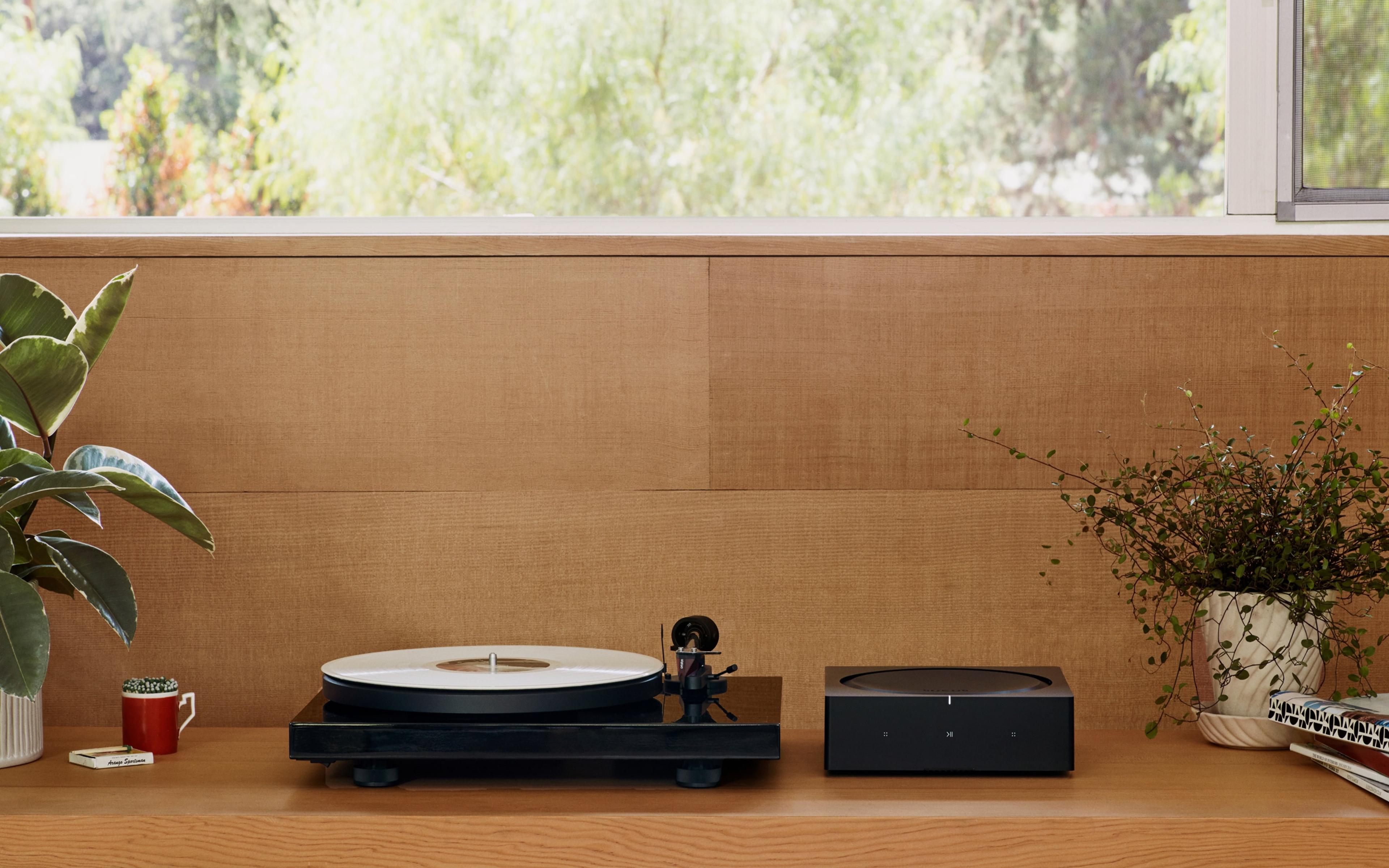 Sonos Amp with turntable on shelf below window