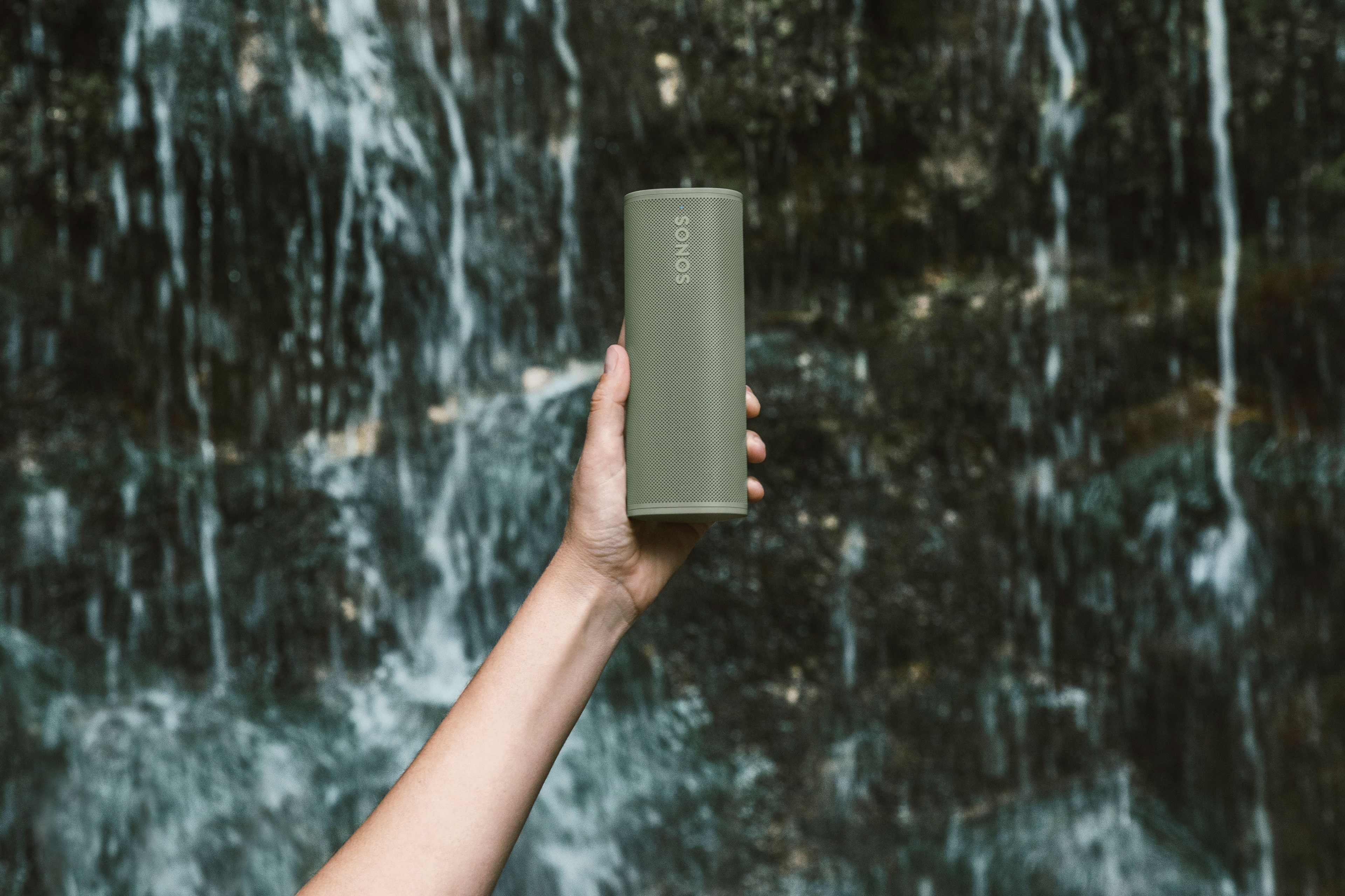 Roam 2 Olive with waterfall background