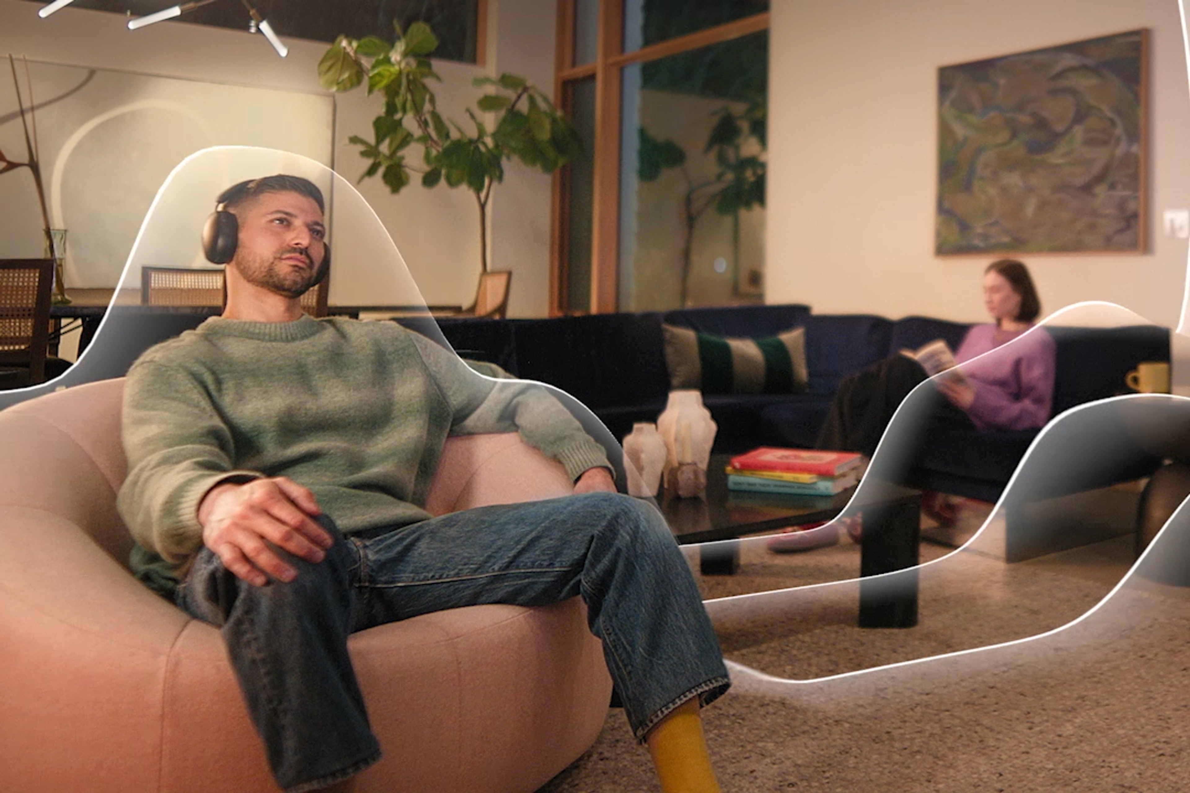 Person listening to Sonos Ace headphones with TrueCinema animation