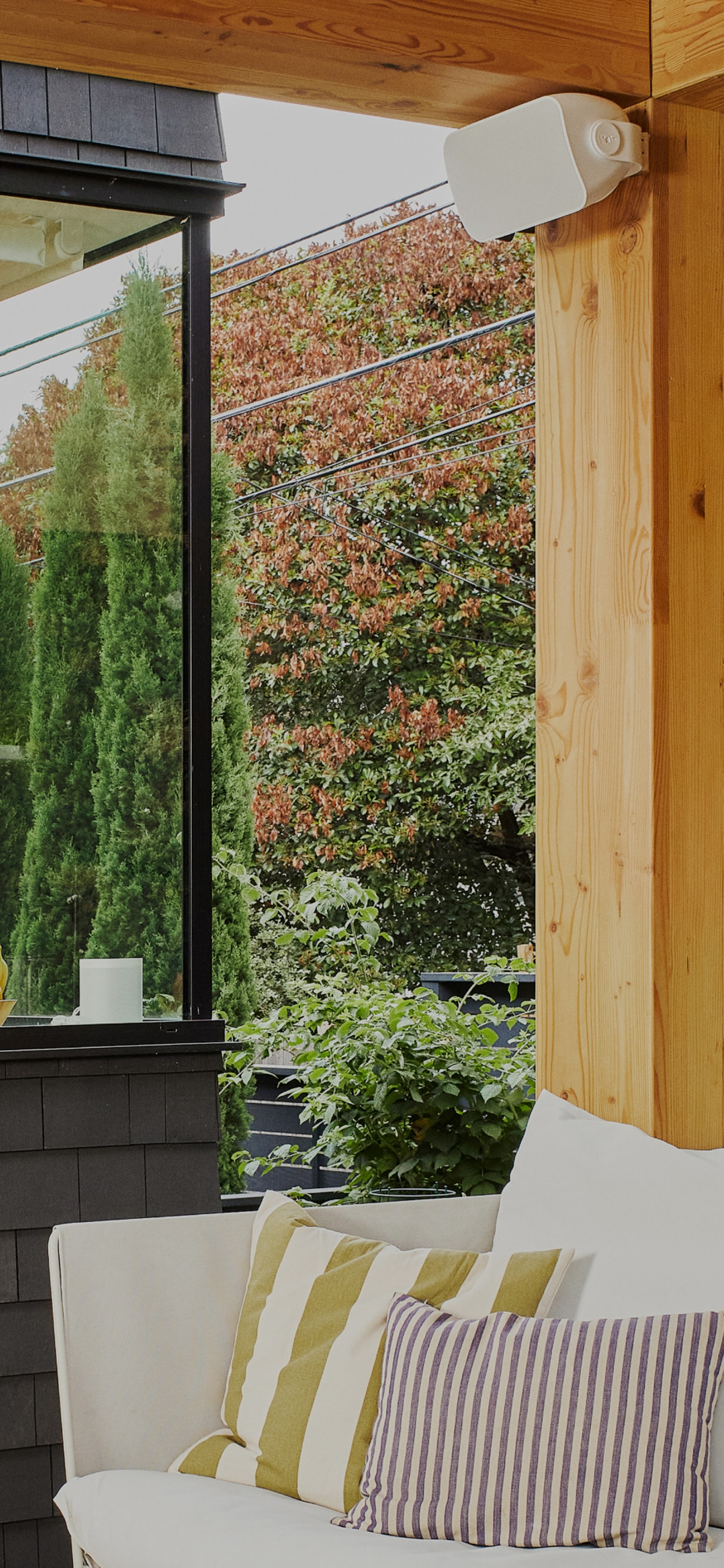 Sonos and Sonance Outdoor speaker installed under awning of outdoor patio