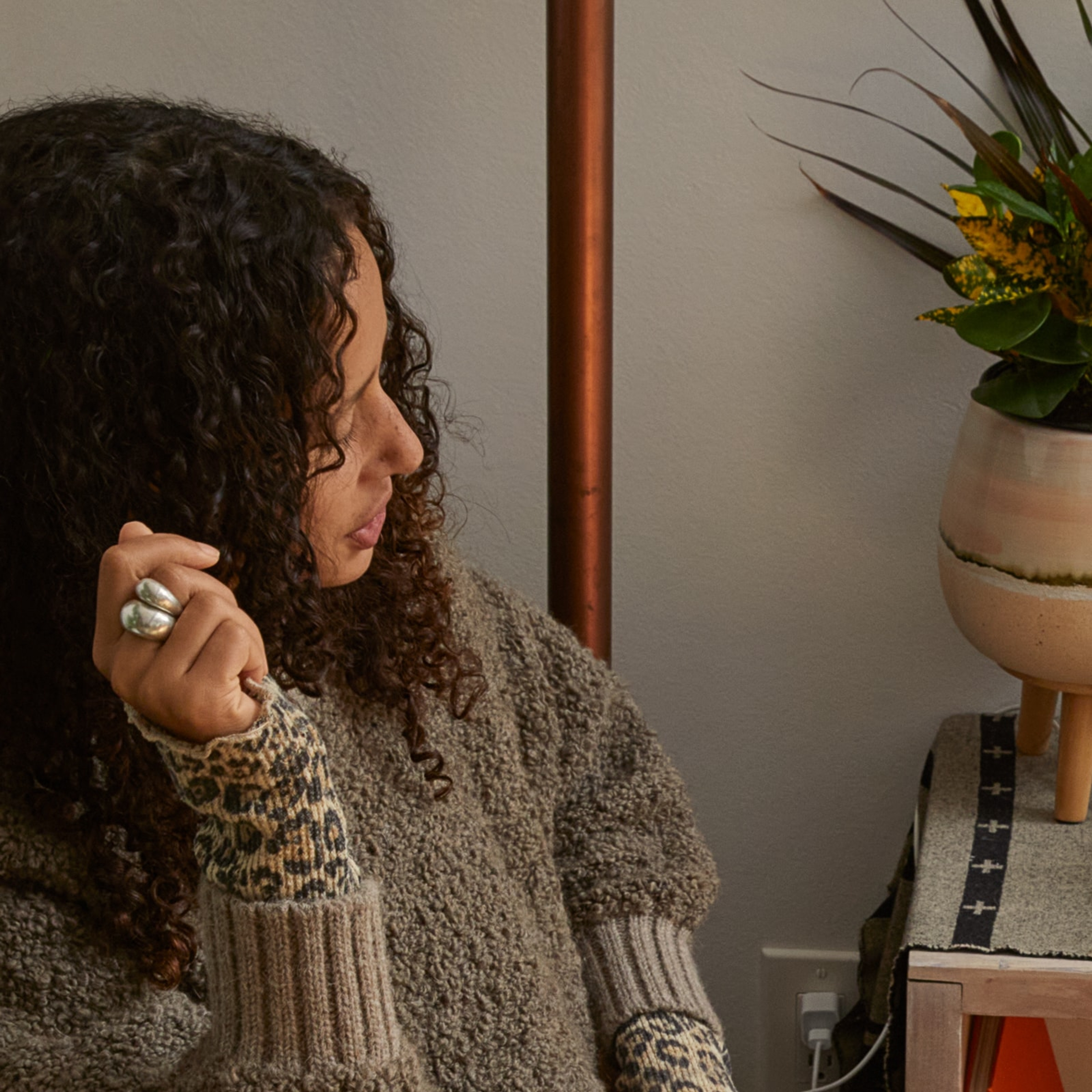Closeup of Sonos user giving voice commands to her Sonos speaker