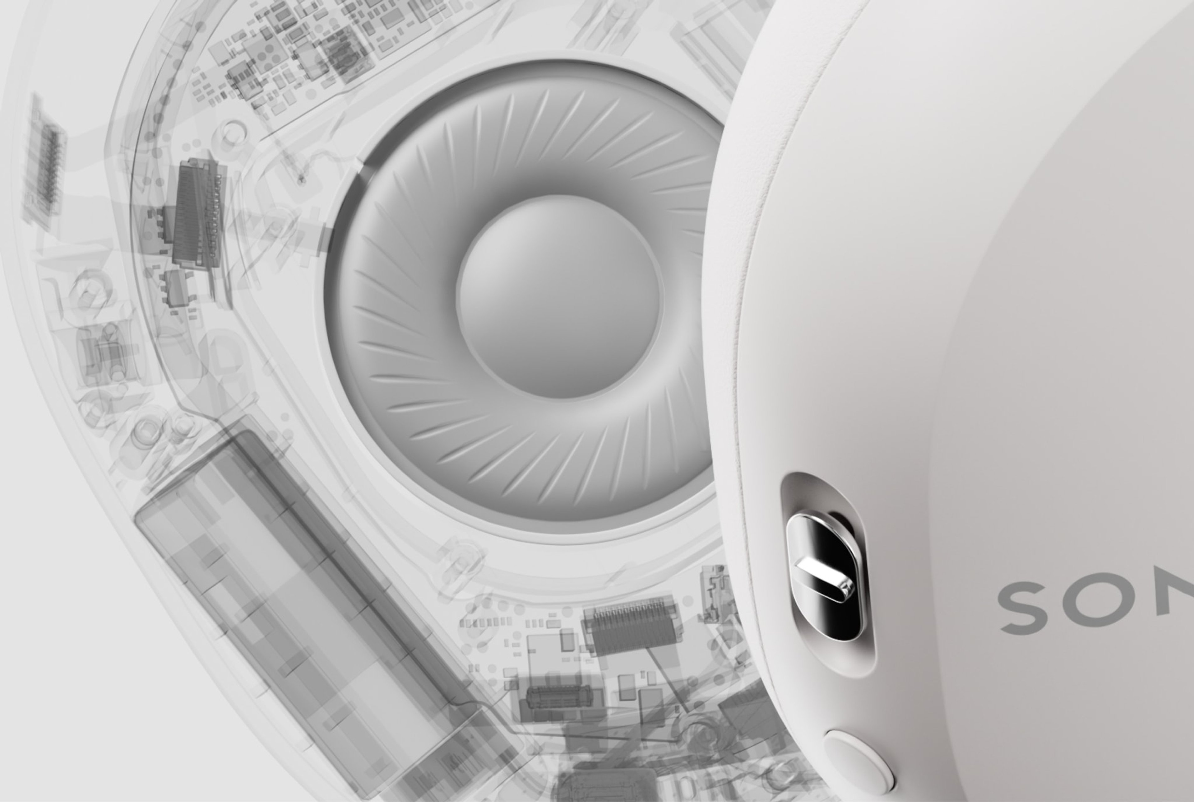 Closeup of a driver inside a pair of white Sonos Ace headphones