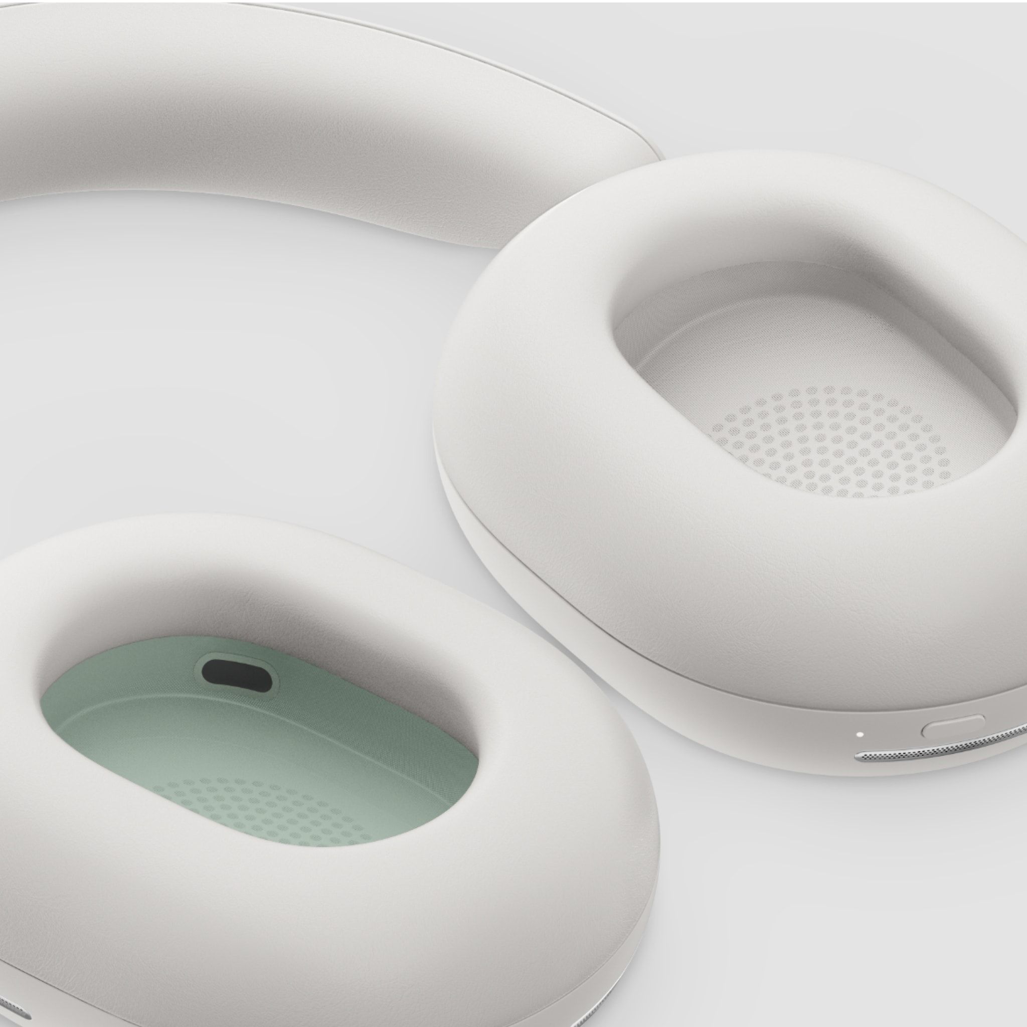 Closeup of the inner ear cups on a pair of white Sonos Ace headphones