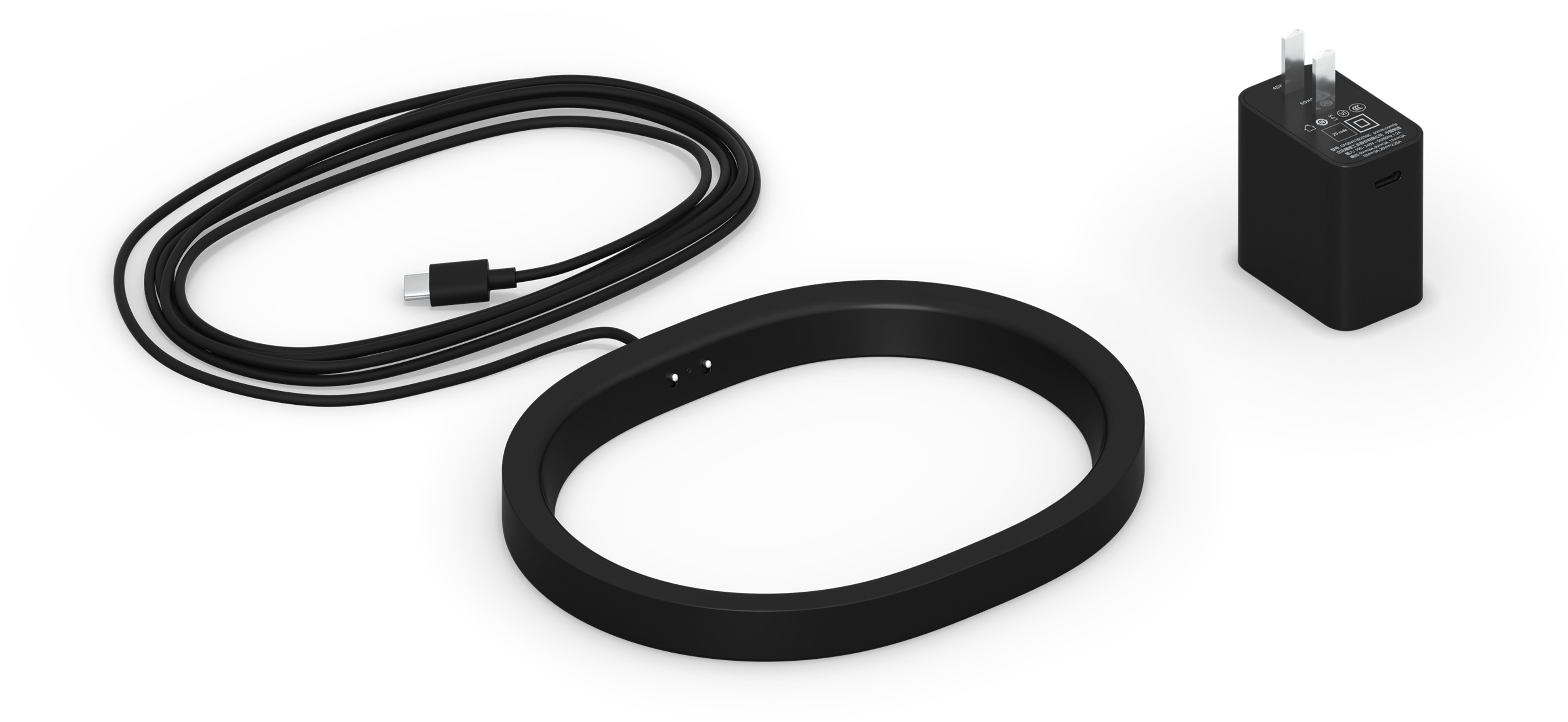 黑色Move 2无线充电座以及相应区域电源插头的图片