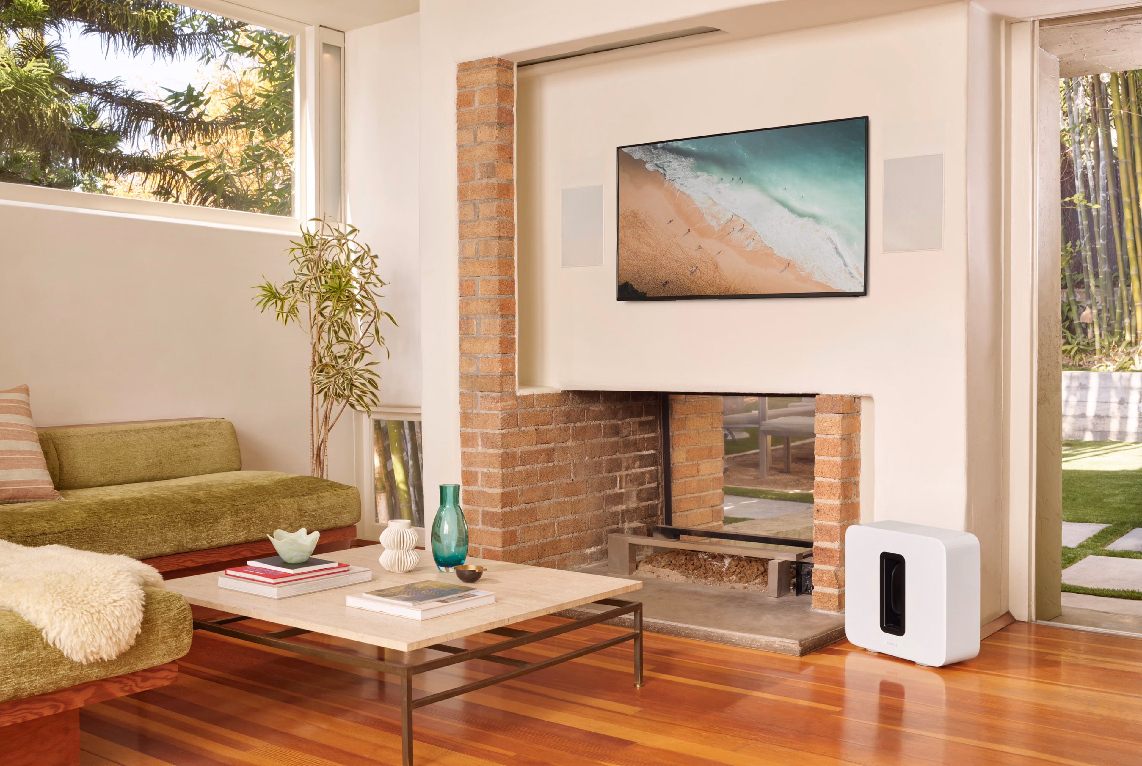 Home cinema system with Sonance In-Wall speakers and white Sonos Sub