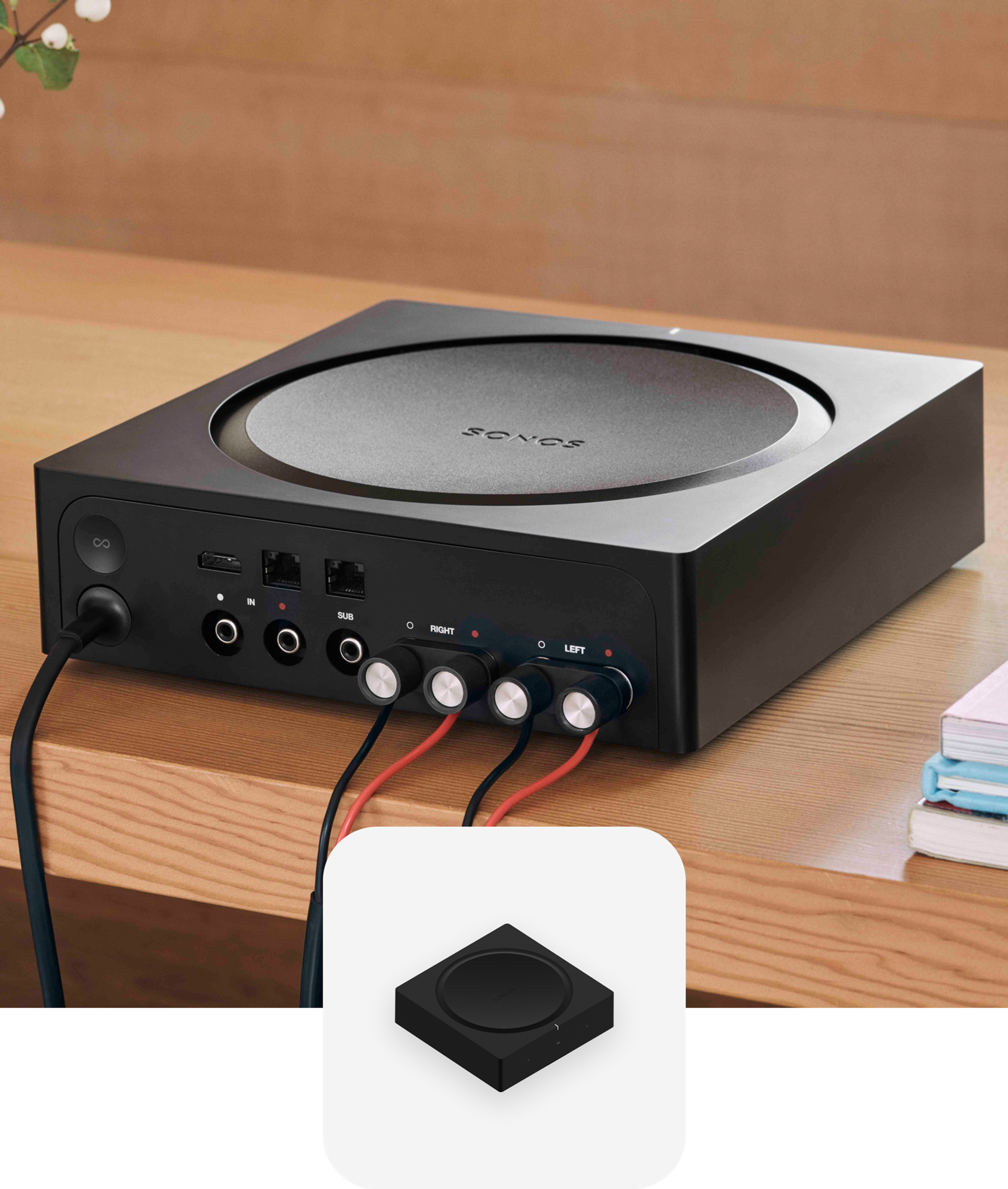 The back of a Sonos Amp with power and speaker wires connected