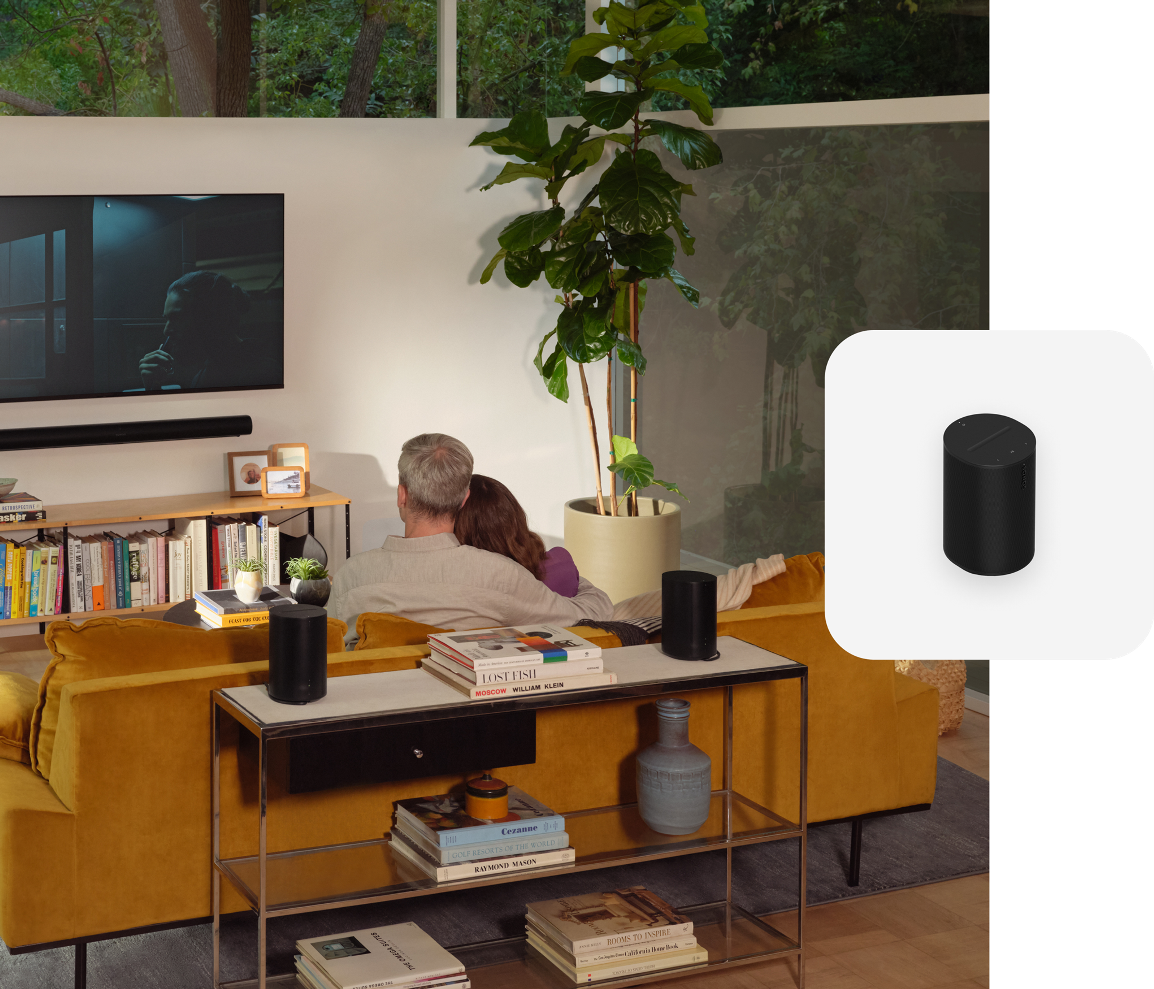 Dual Era 100 on a console table with a couple watching TV and a black Era 100 product tile overlay