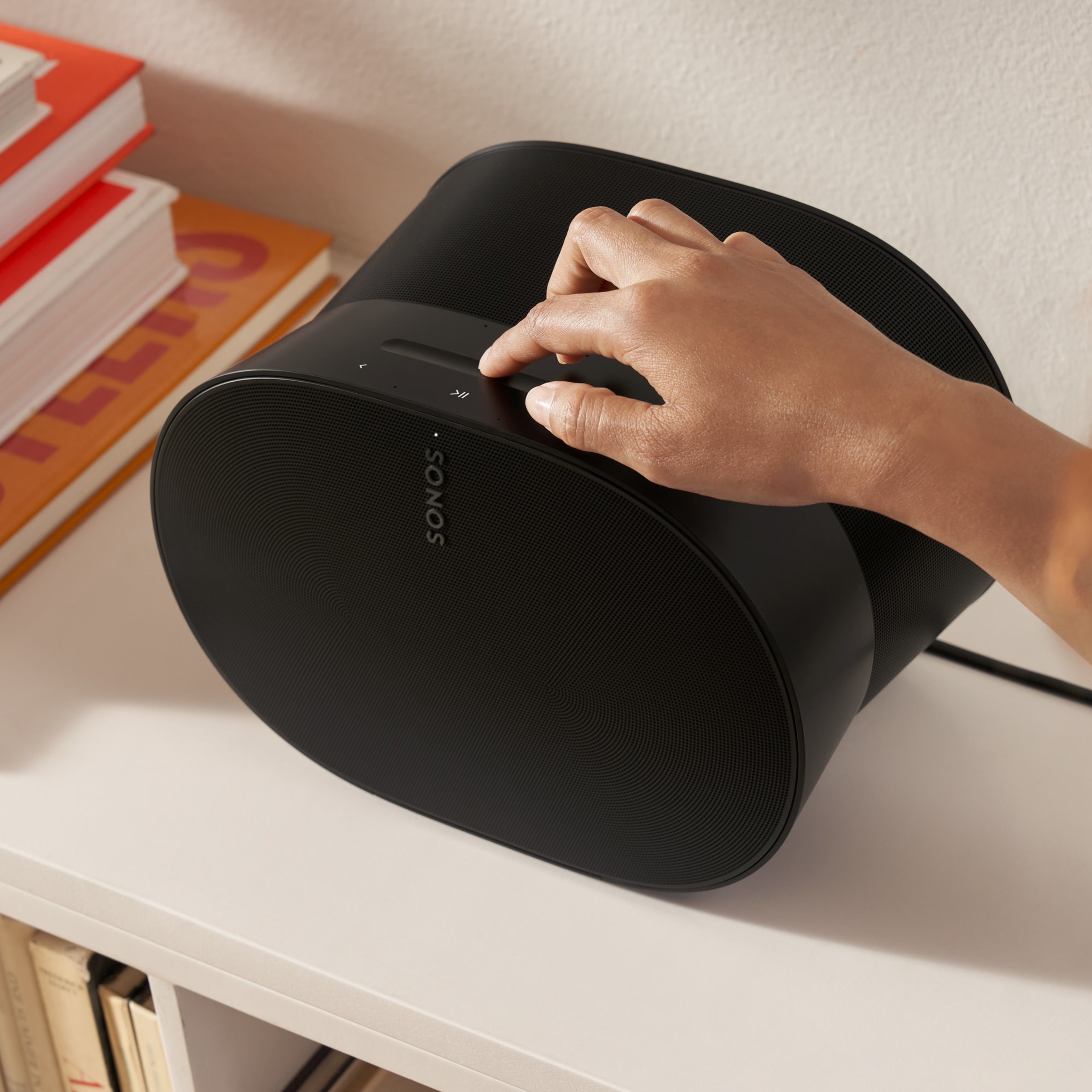 Easy-to-use touch controls on the top of a black Era 300 speaker