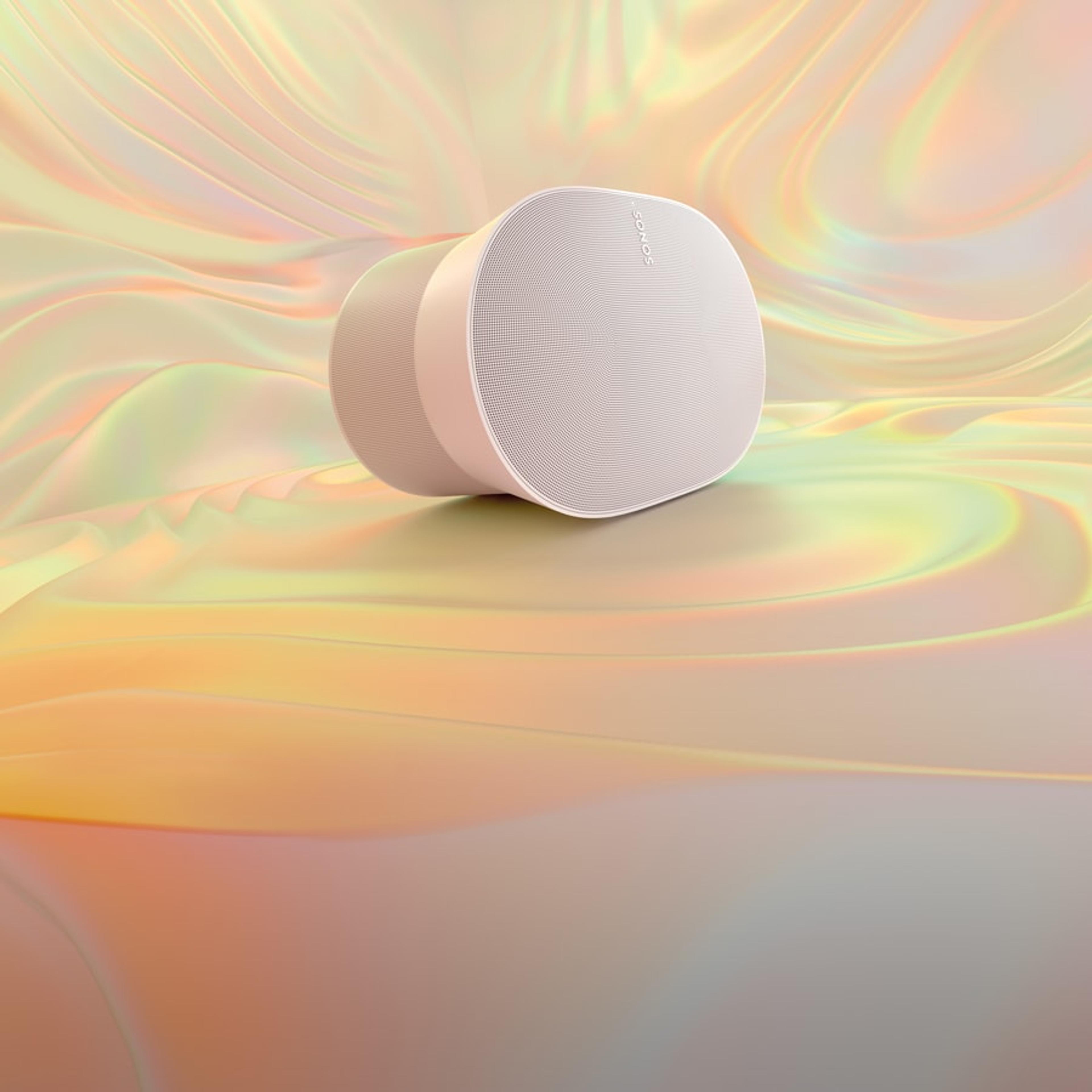 A white Sonos Era 300 on a multicolor gradient background