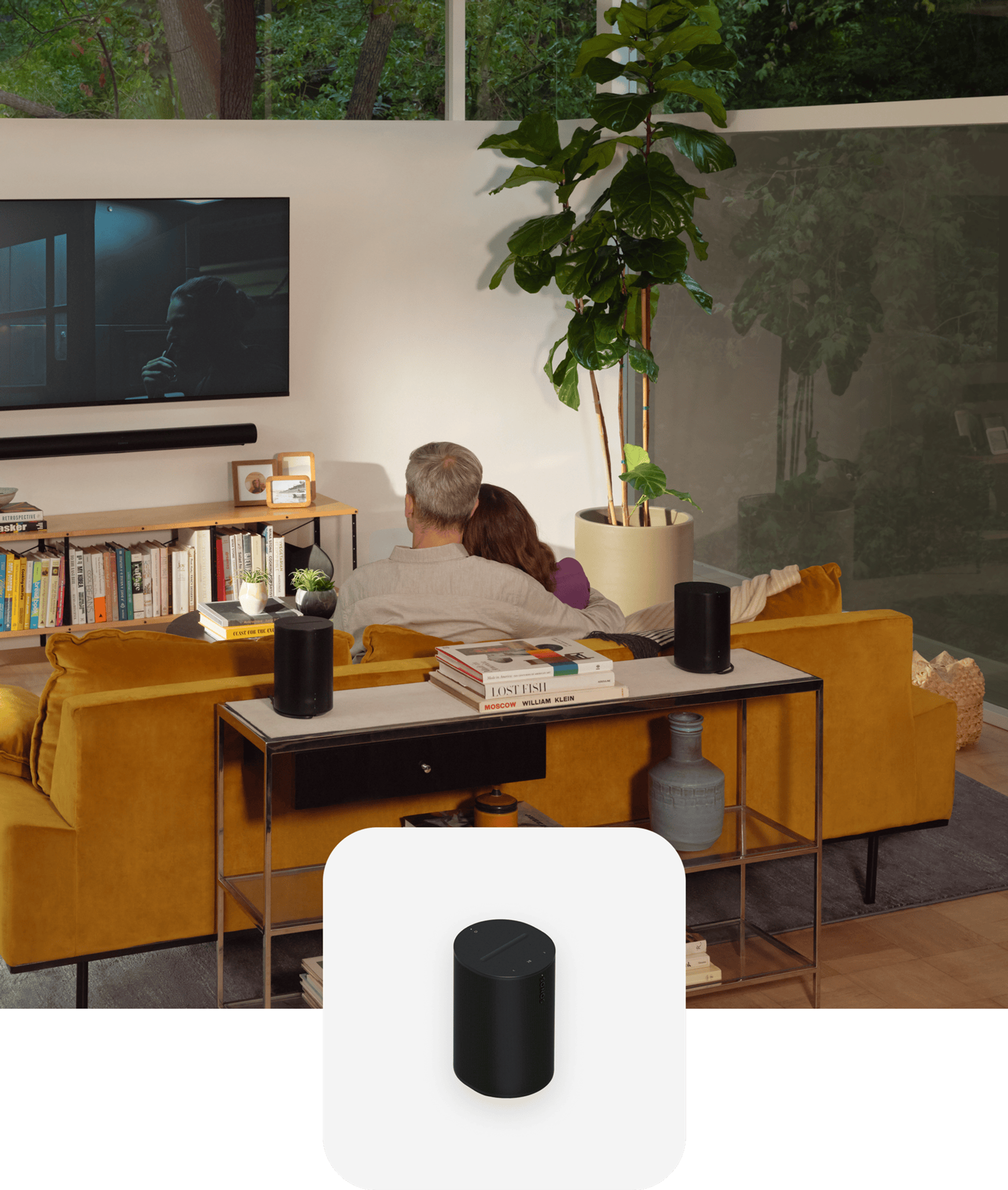 Dual Era 100 on a console table with a couple watching TV and a black Era 100 product tile overlay