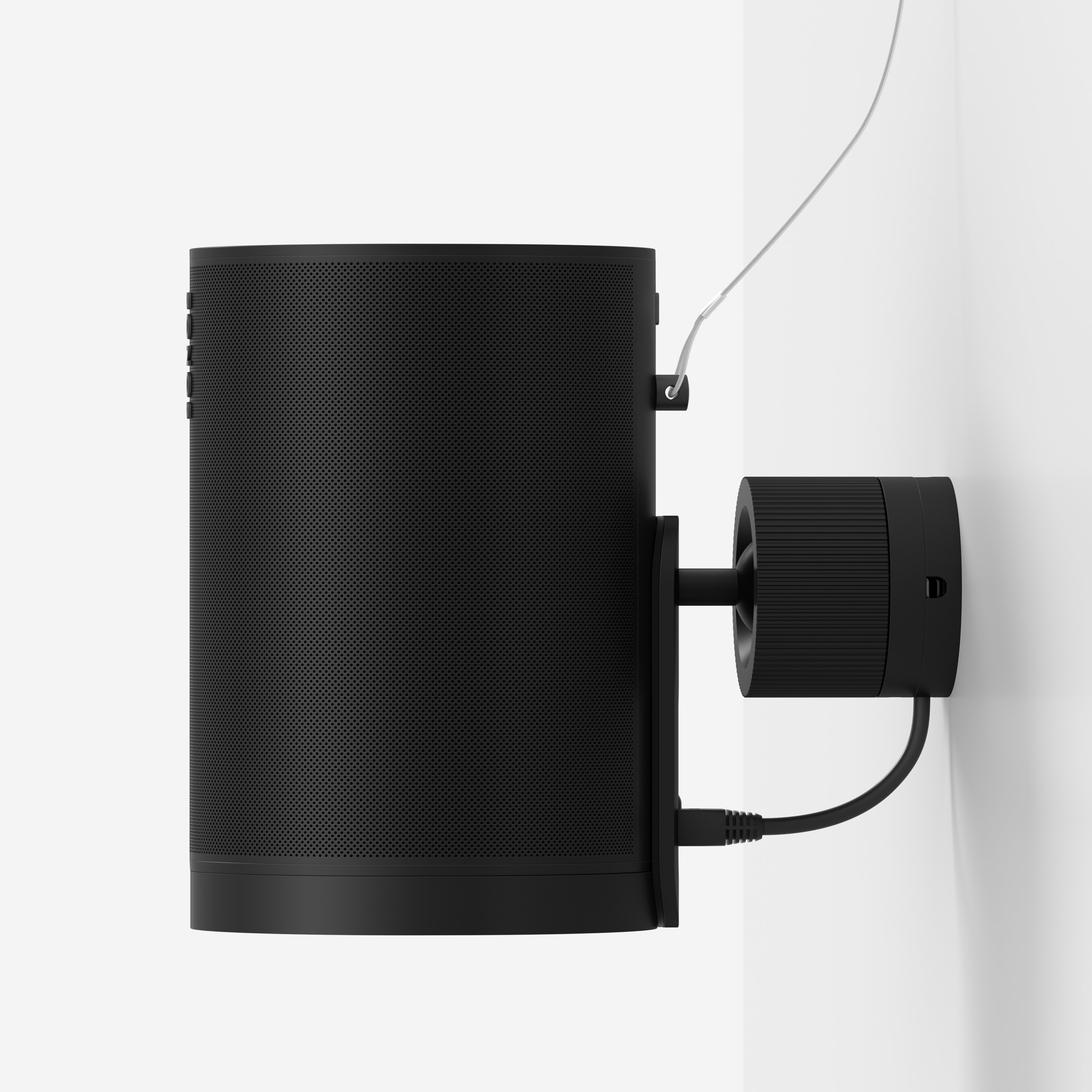 A black Era 100 Pro speaker mounted to the wall with a secondary safety attachment