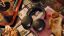 Black Sonos Ace Ultra headphones on a table with various decorations