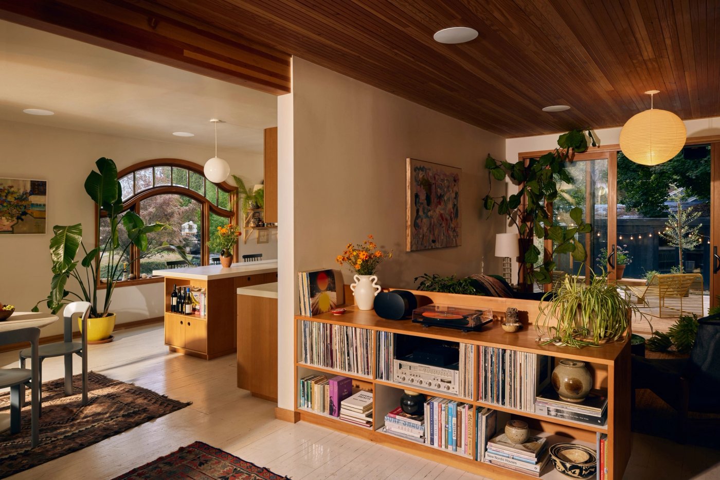 Open-plan kitchen and living room with discreet in-ceiling speakers