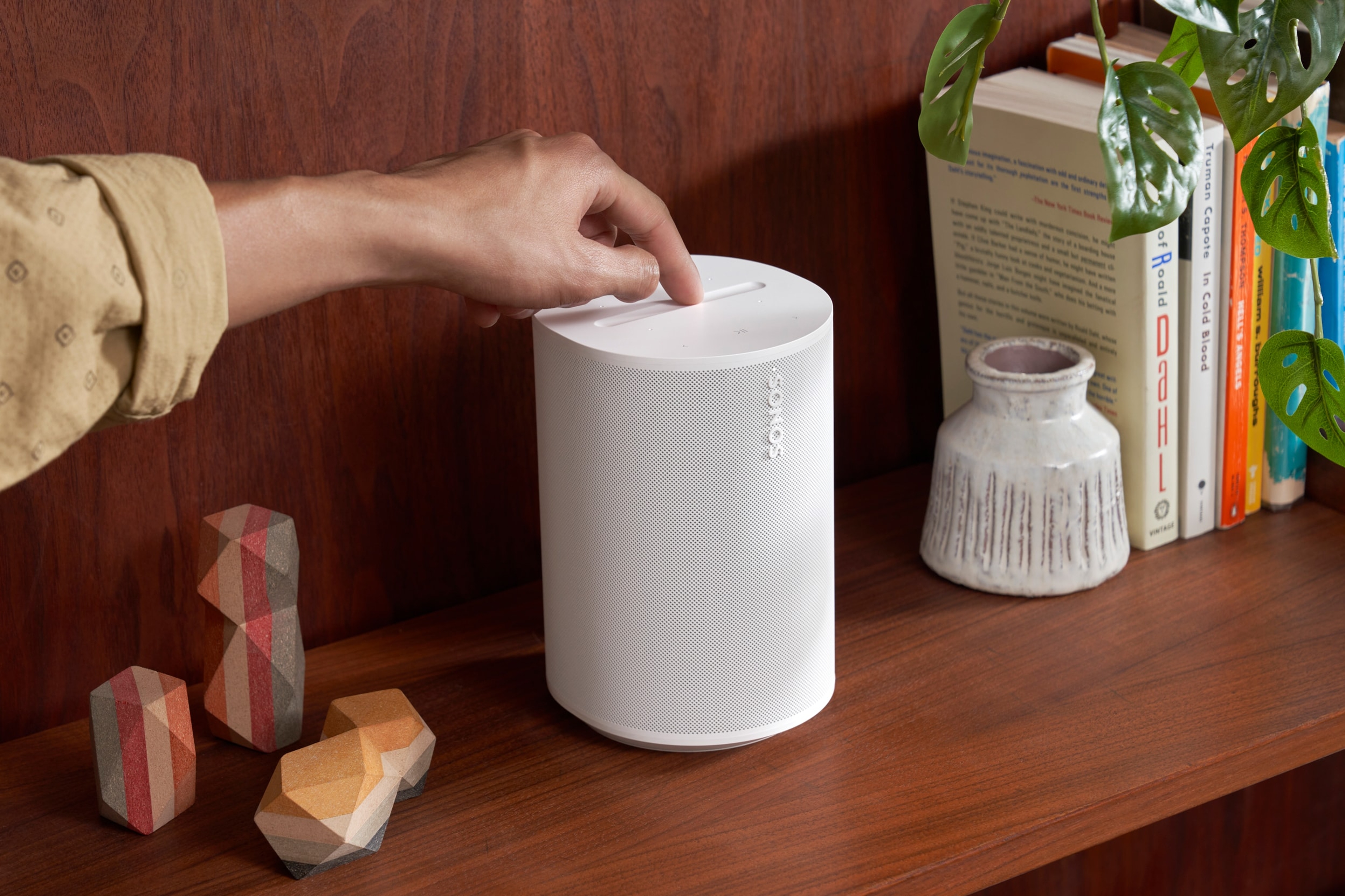 Era 100 White on a bookshelf