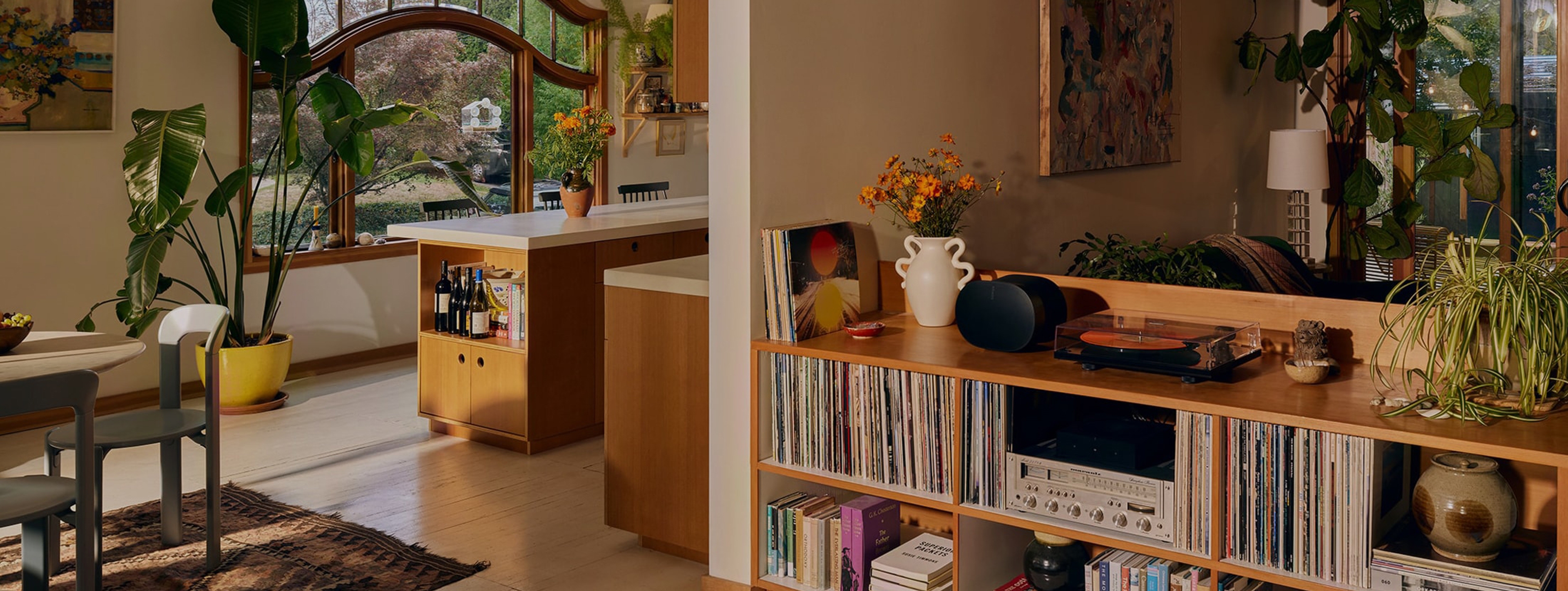 A black Era 300 speaker on top of a console table in a living room