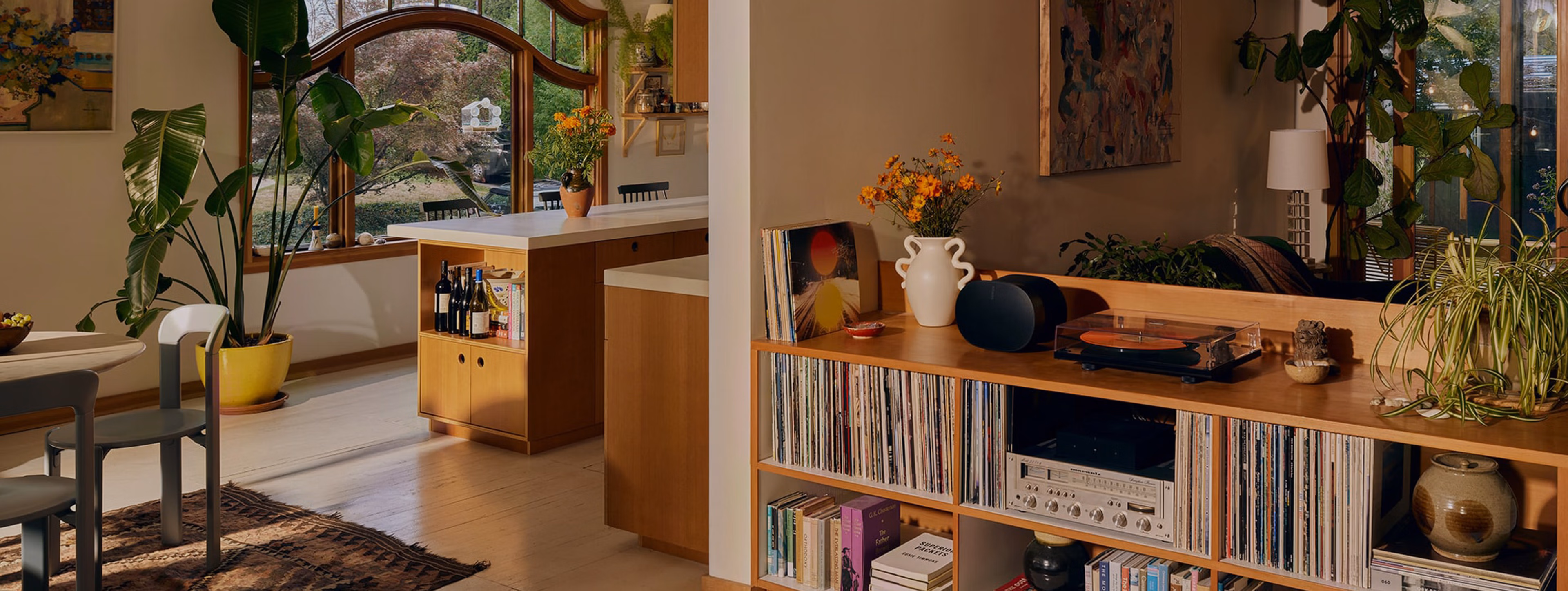 A black Era 300 speaker on top of a console table in a living room