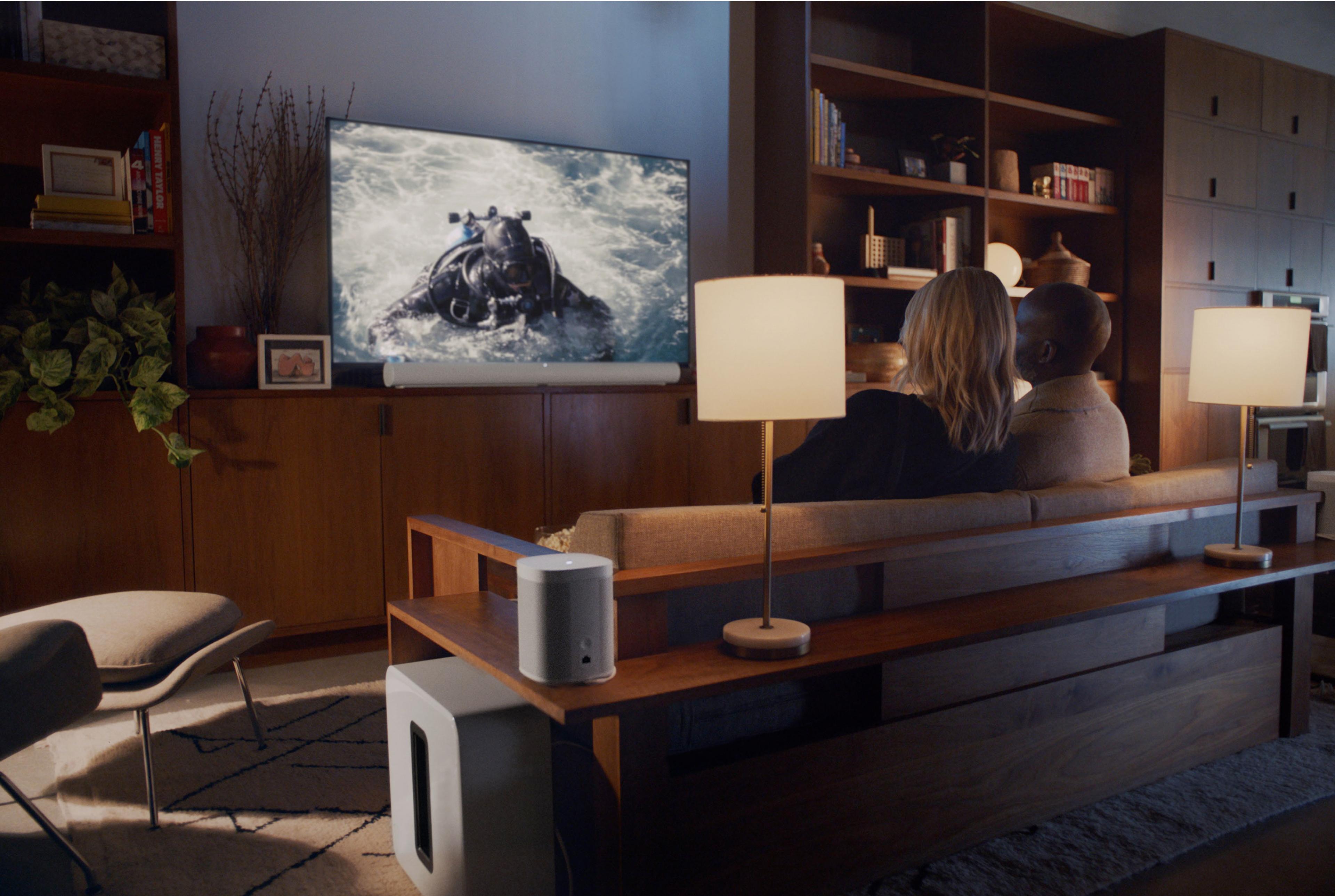 White sub in living room with TV and lamps