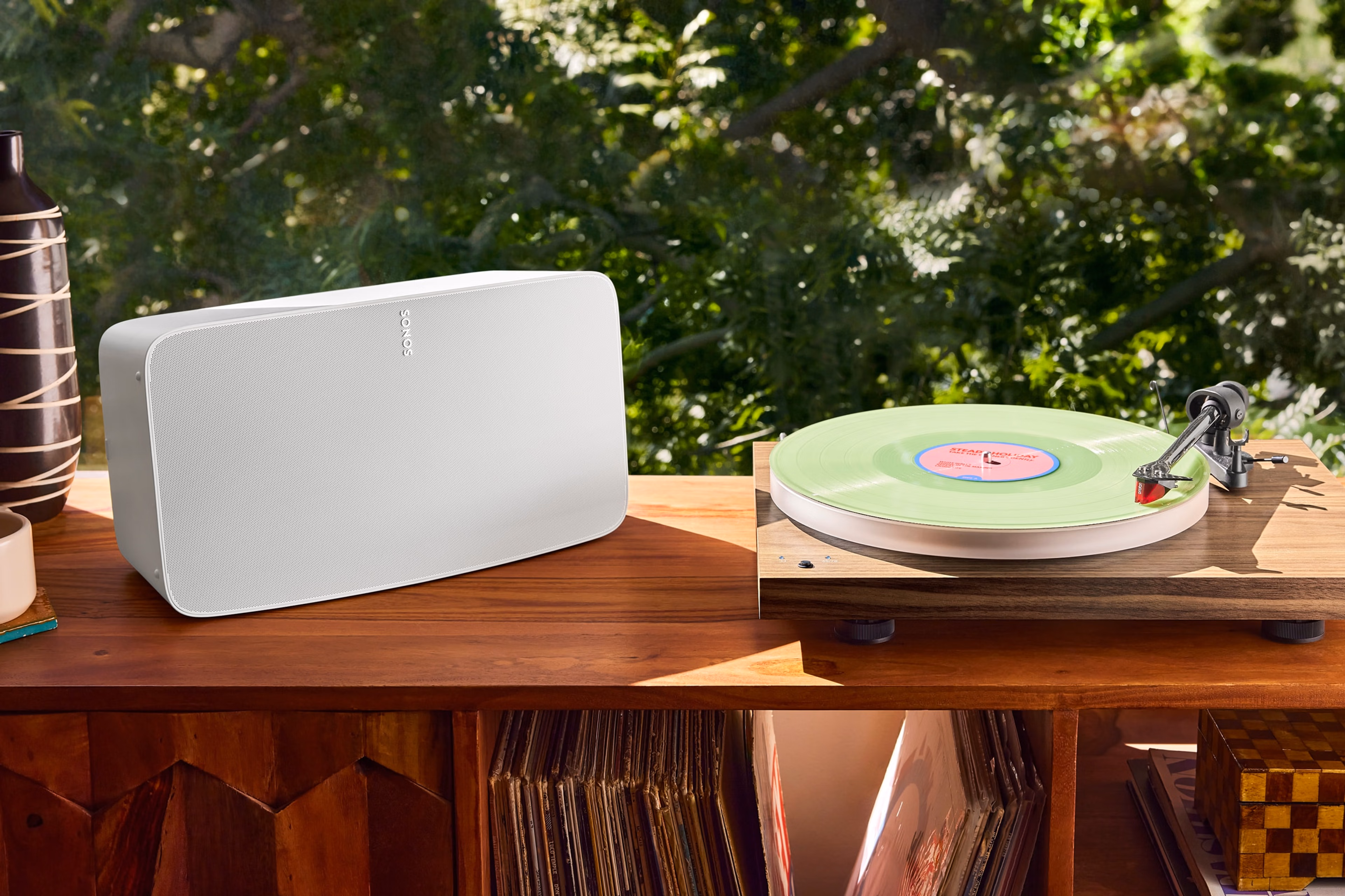 White Sonos Five next to a vinyl turn table