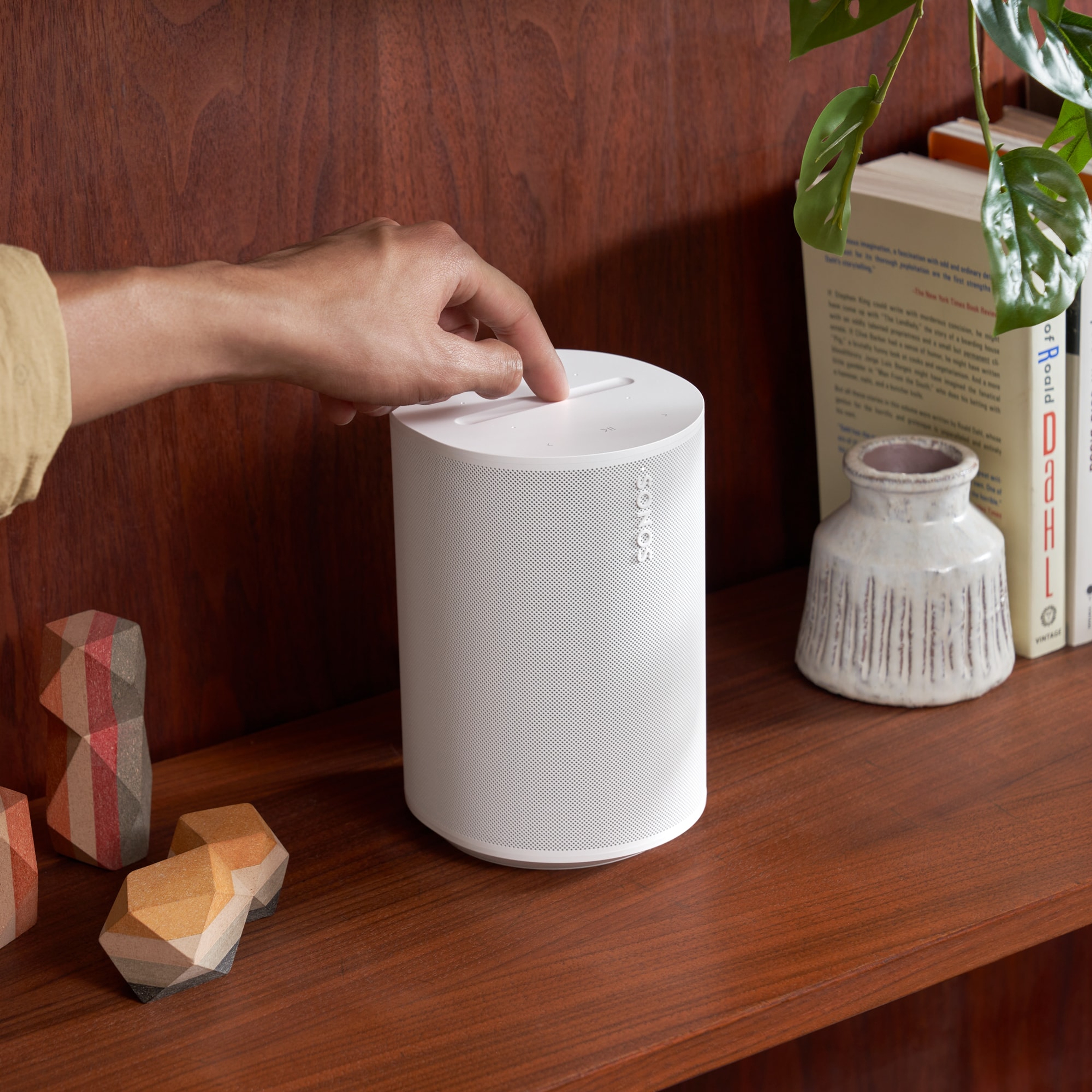 Easy-to-use touch controls on the top of a white Era 100 speaker