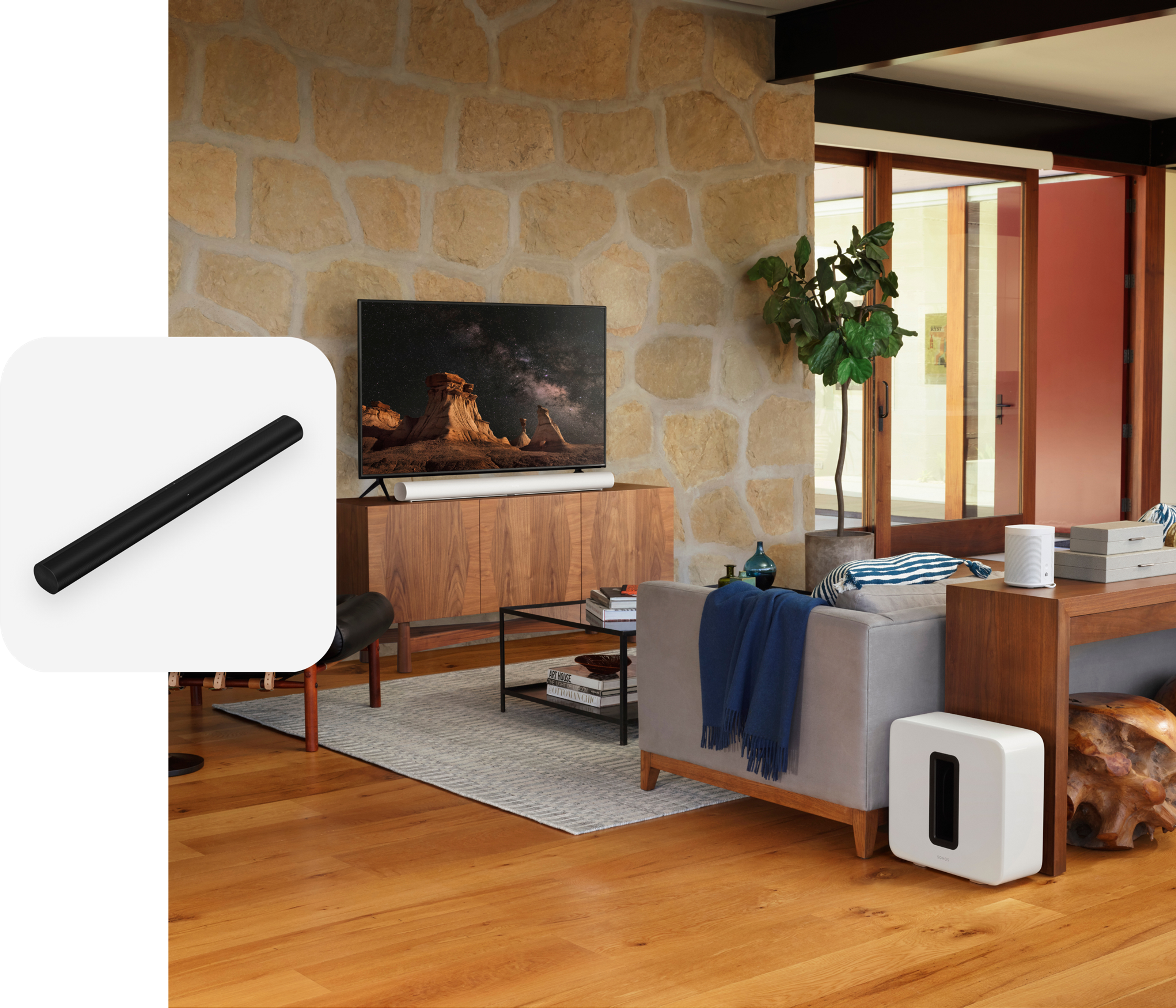 A home theater setup in a living room featuring white Sonos Arc, Sub, and two Era 100 speakers