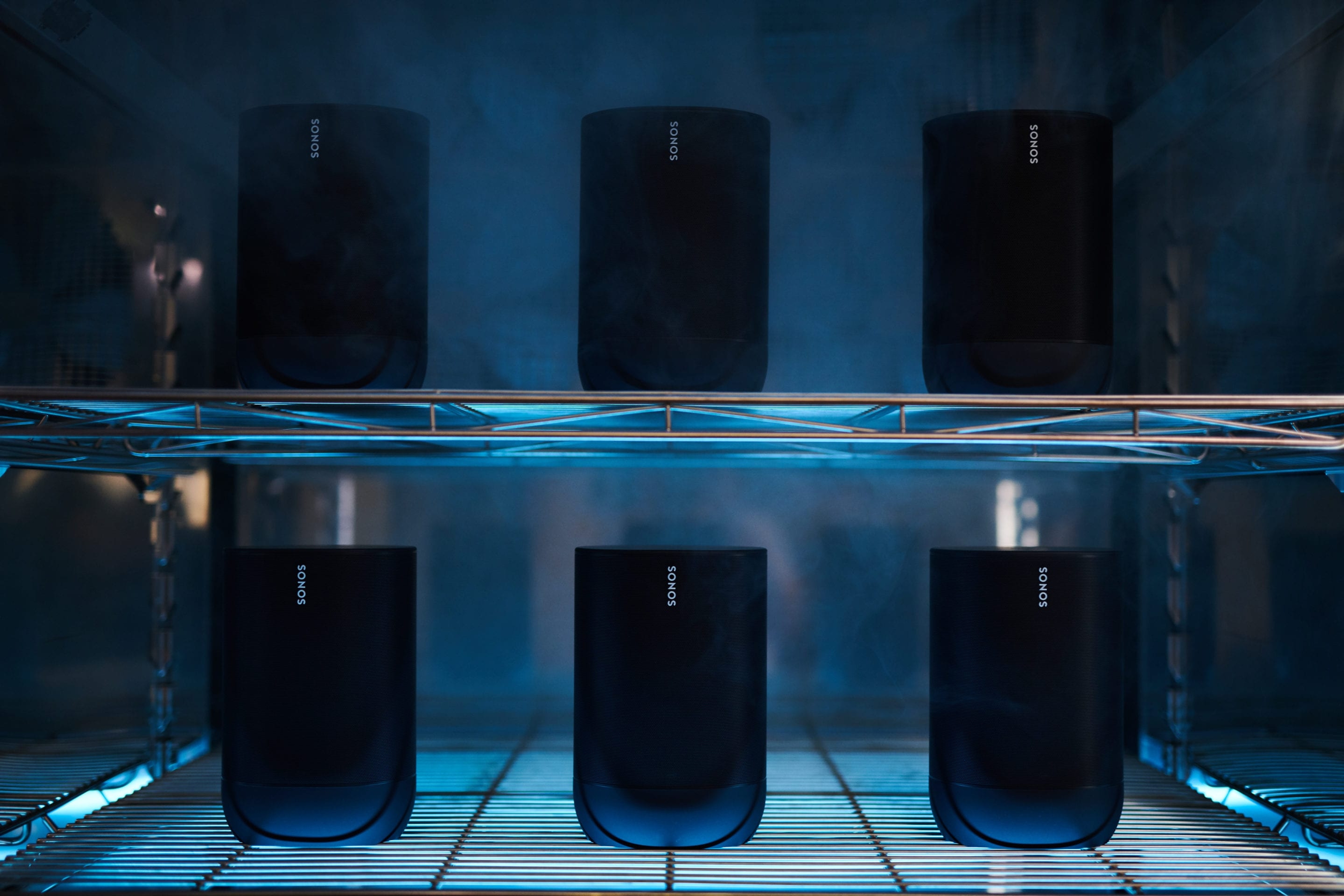 Six Sonos Move speakers on shelves in the hardware lab being temperature tested