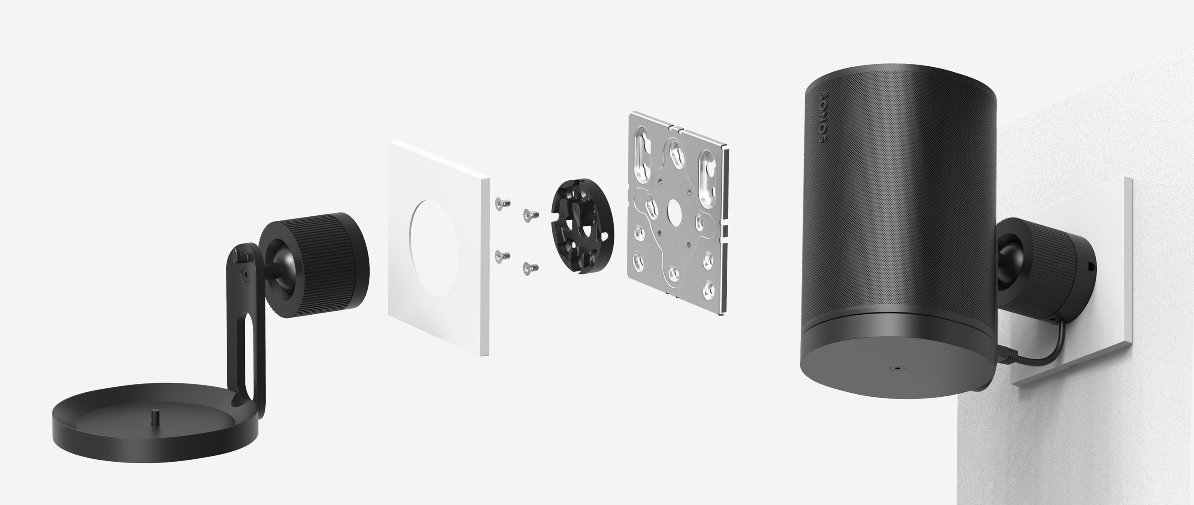 A black Era 100 Pro Surface Mount being attached to a Era 100 Pro Junction Box Adapter