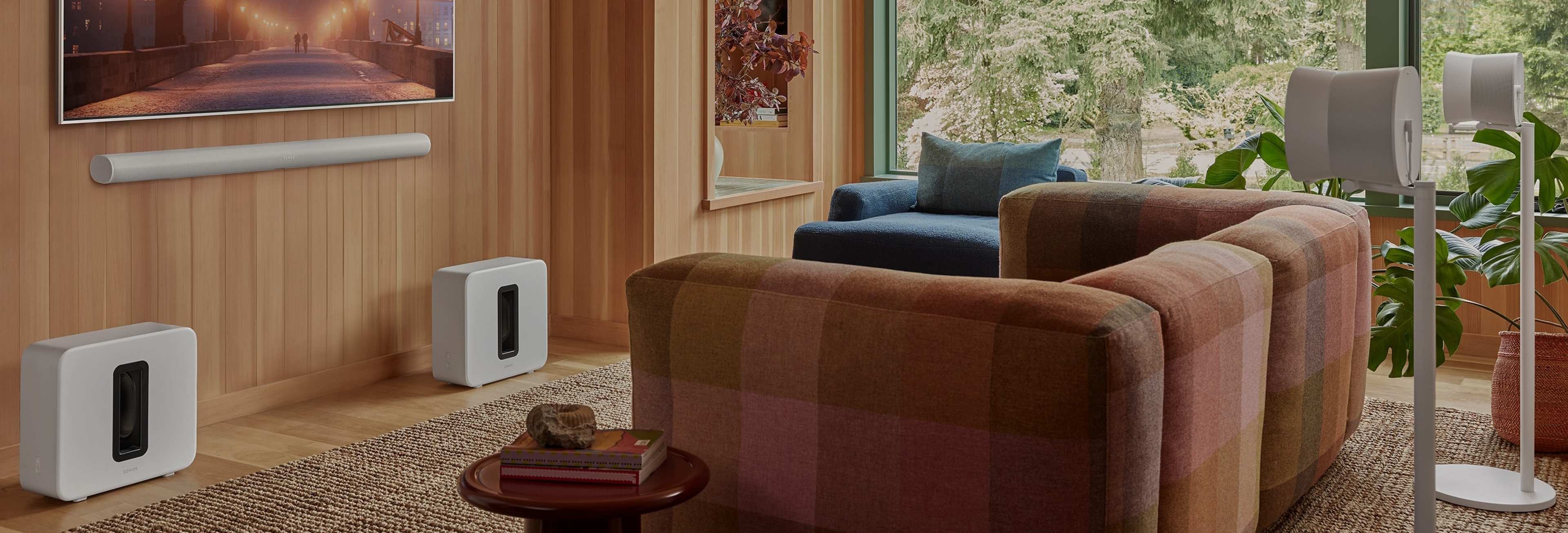 Sonos home theater system with white Arc Ultra, pair of Sub 4 subwoofers and pair of Era 300 rear surrounds