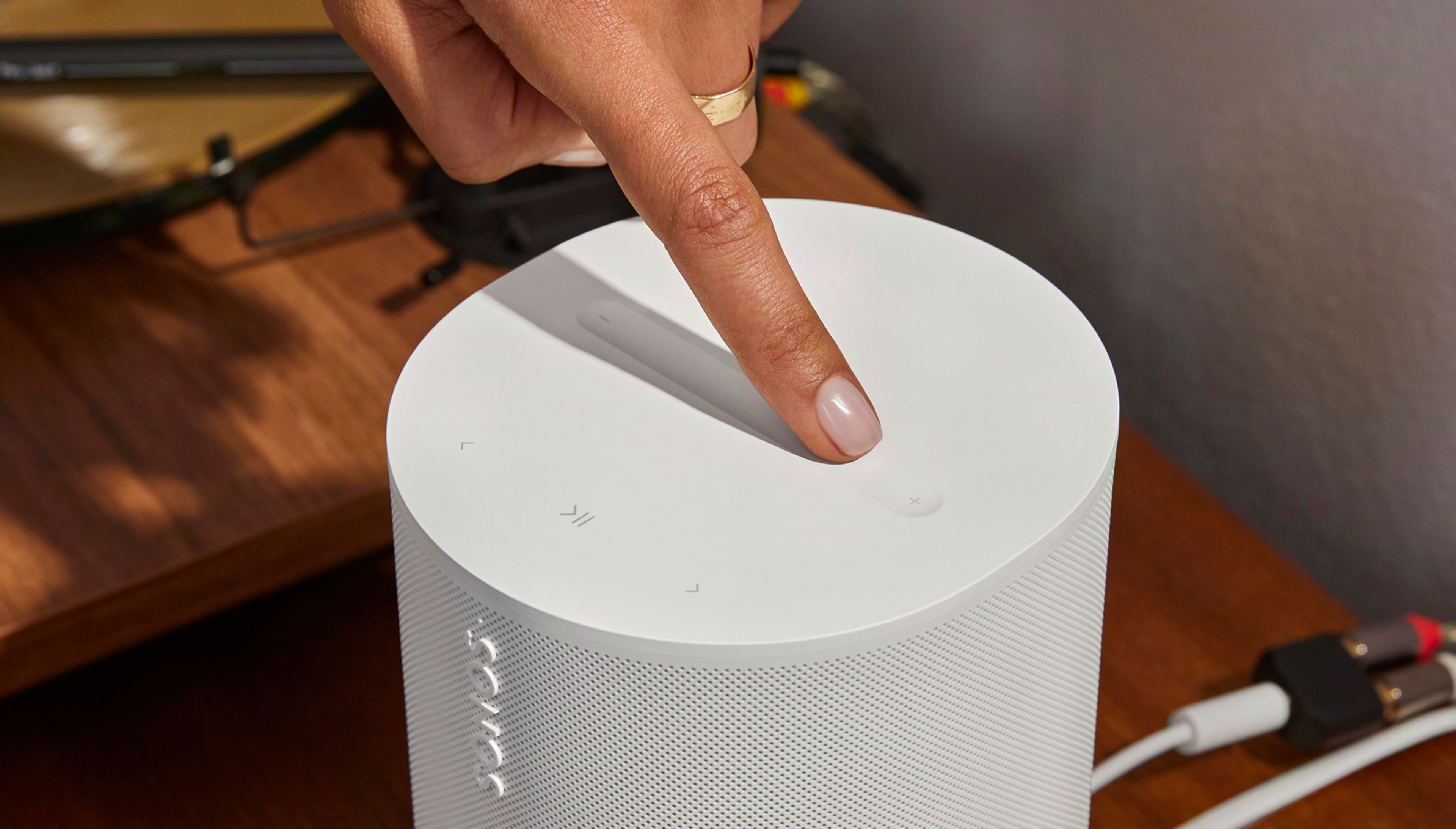 Close-up of white touch controls on the Era 100SL lifestyle speaker