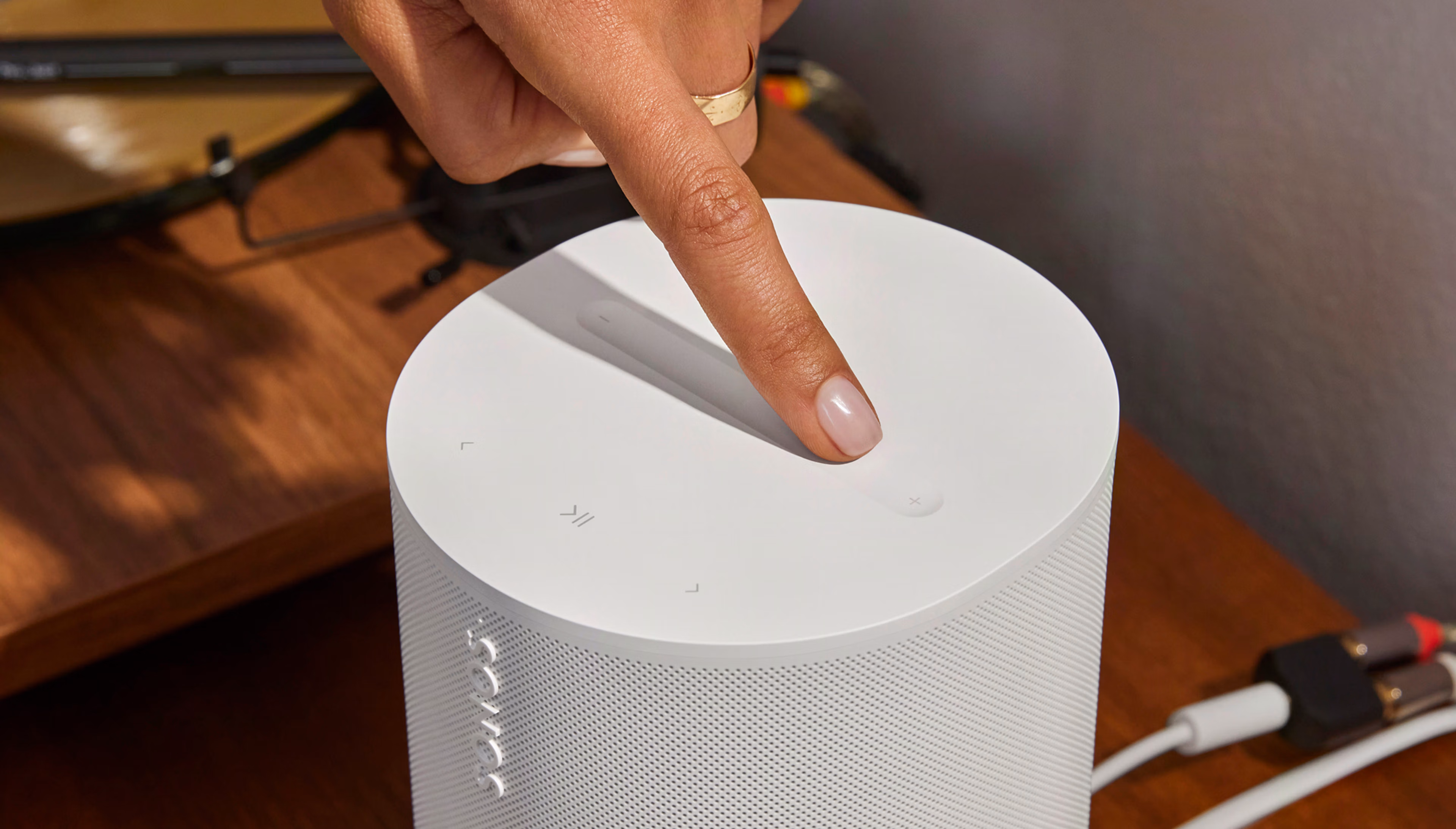 Close-up of white touch controls on the Era 100SL lifestyle speaker