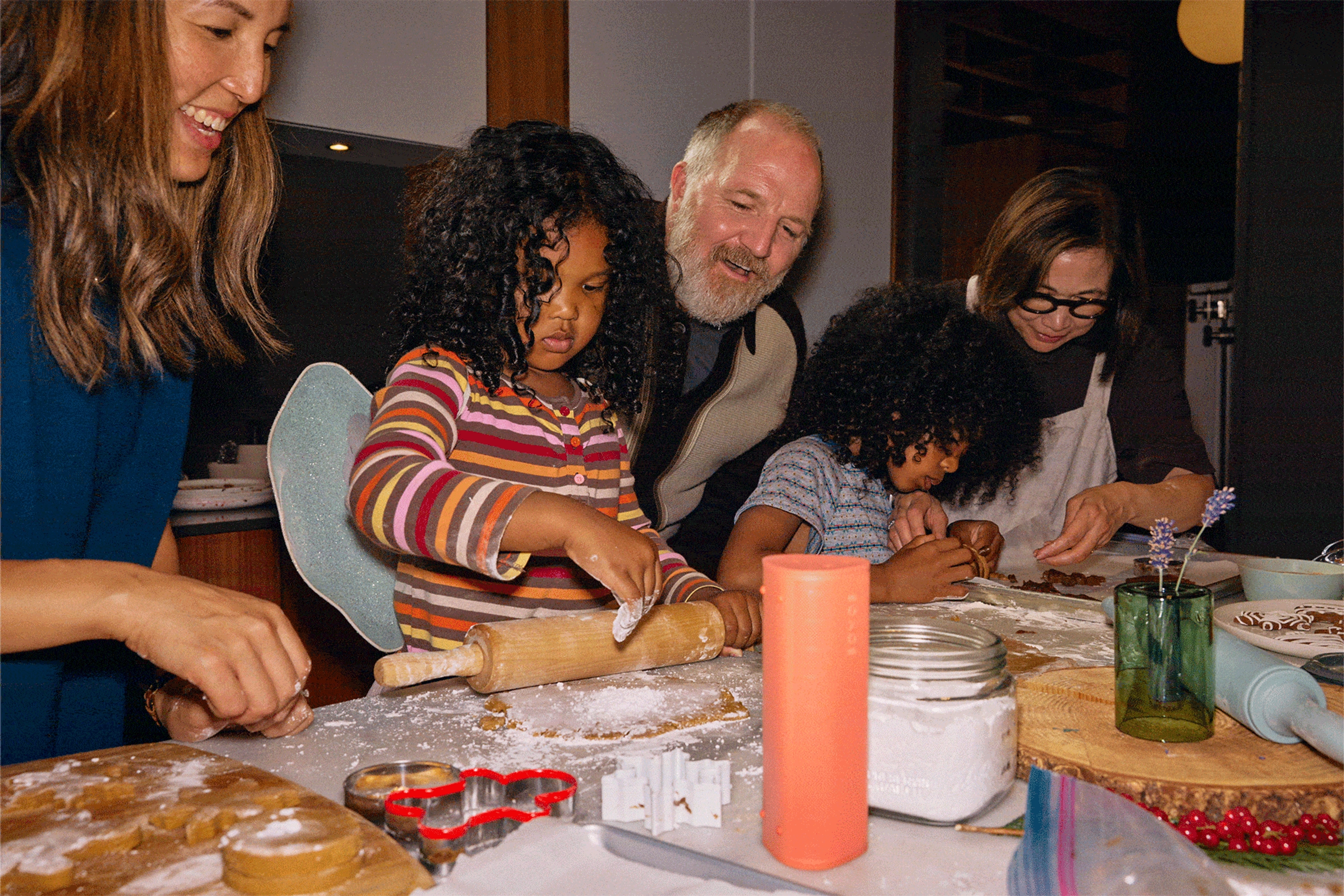 A family baking holiday cookies together