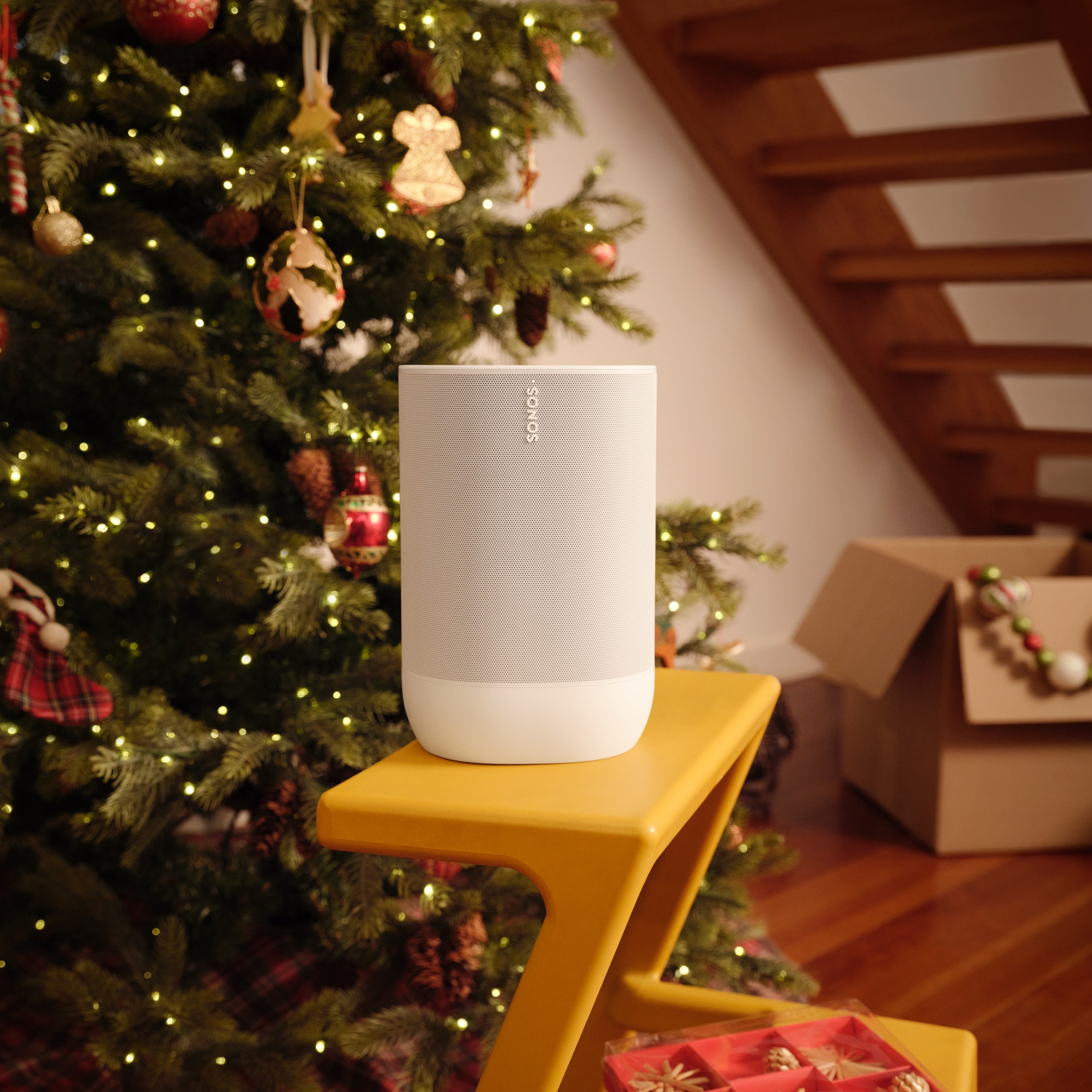 Sonos Move 2 in white next to a Christmas tree