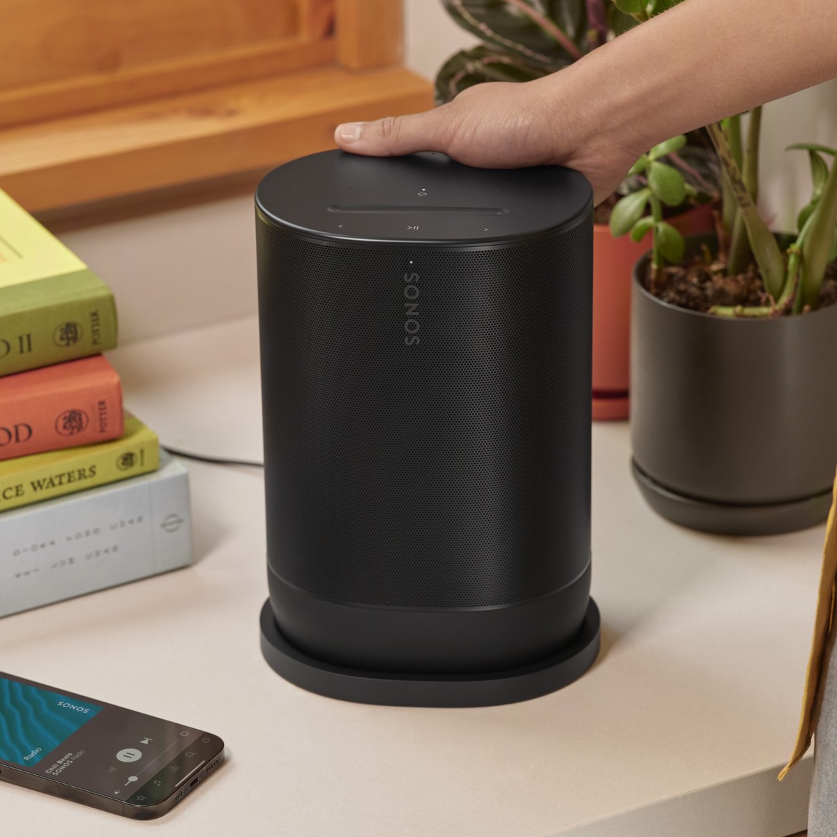 Black Sonos Move 2 portable speaker on a table