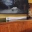 White Sonos Beam Ultra placed under a television