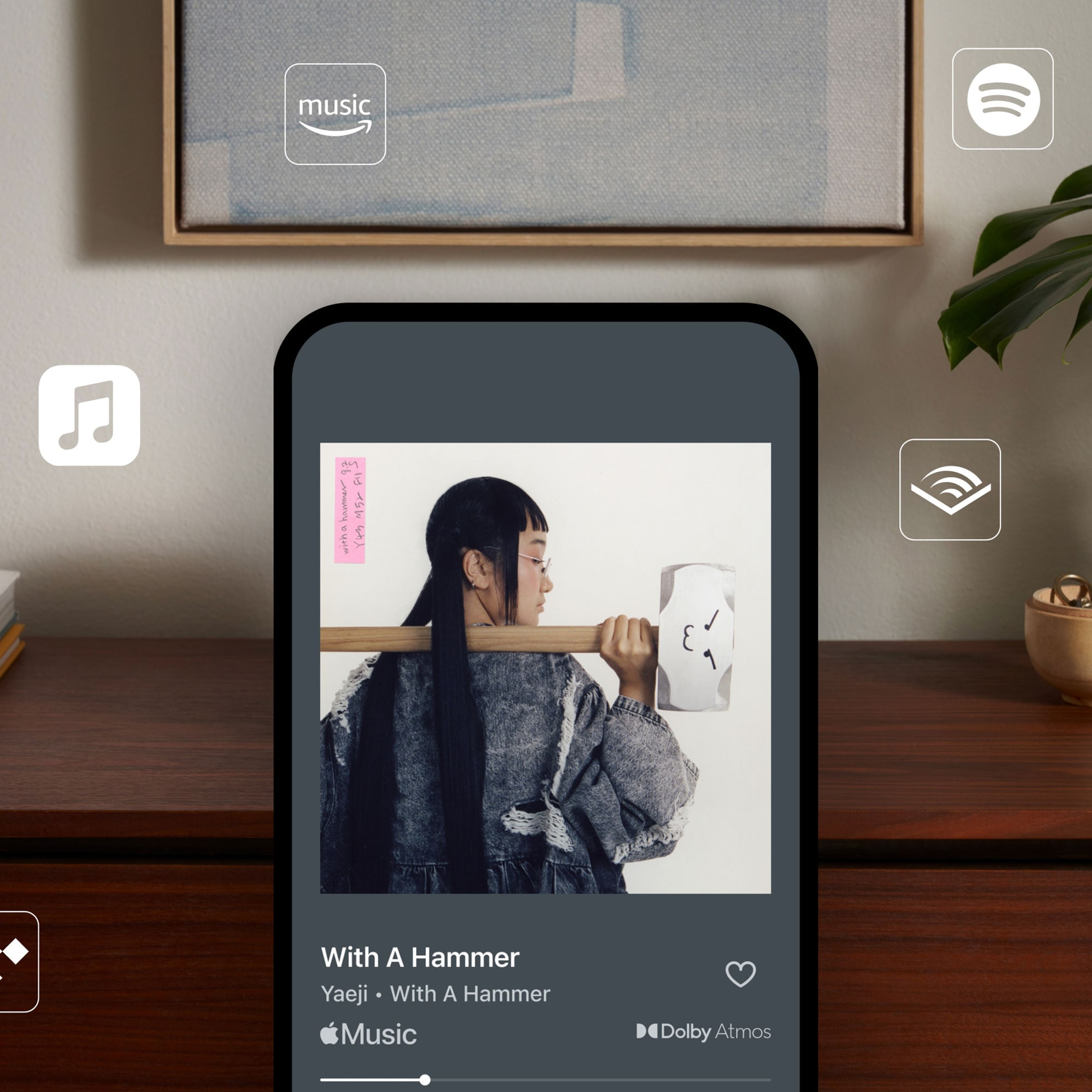 Reproducción de Apple Music en teléfono con logotipos de varios servicios de música en streaming