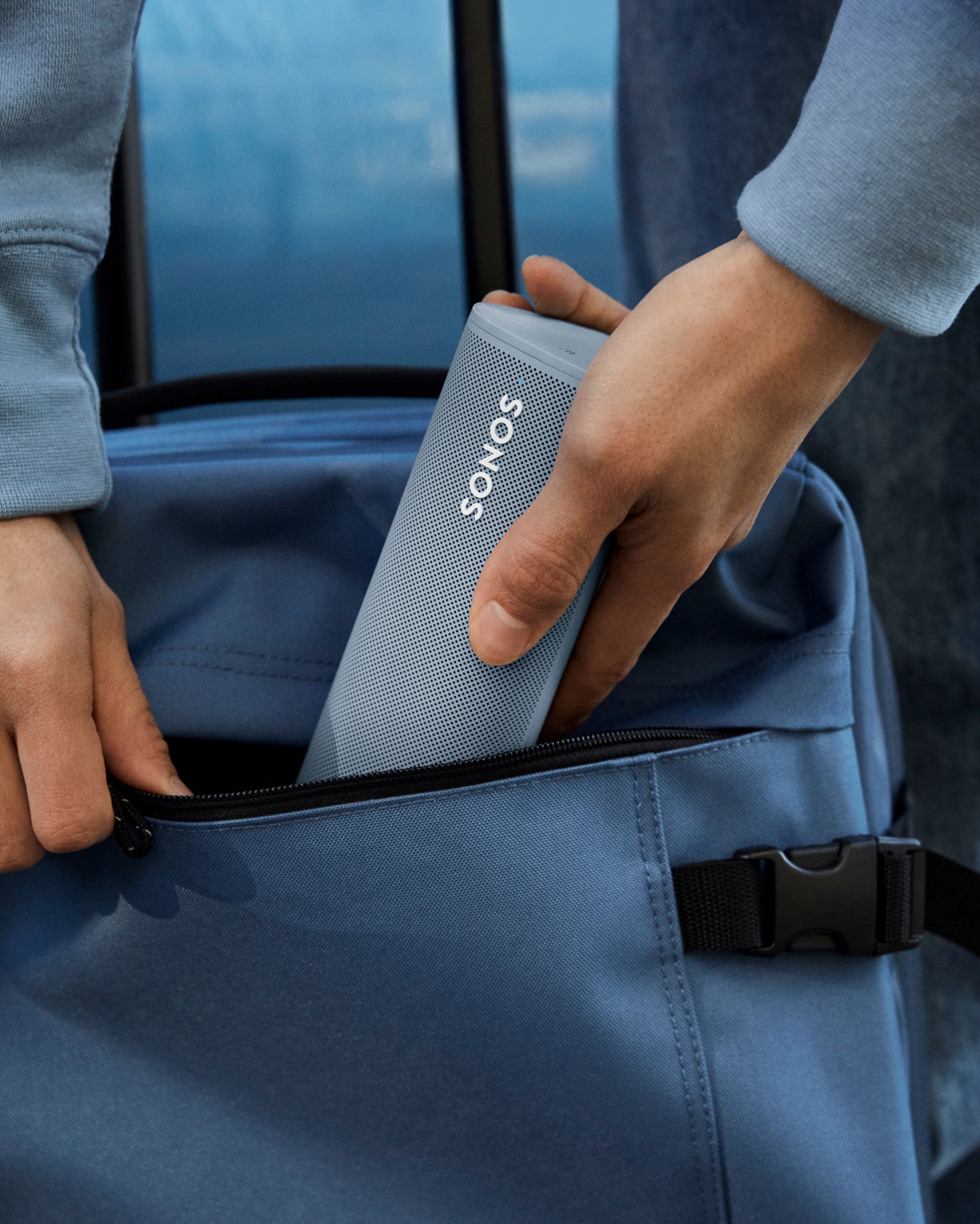 Roam speaker in Wave being put into backpack