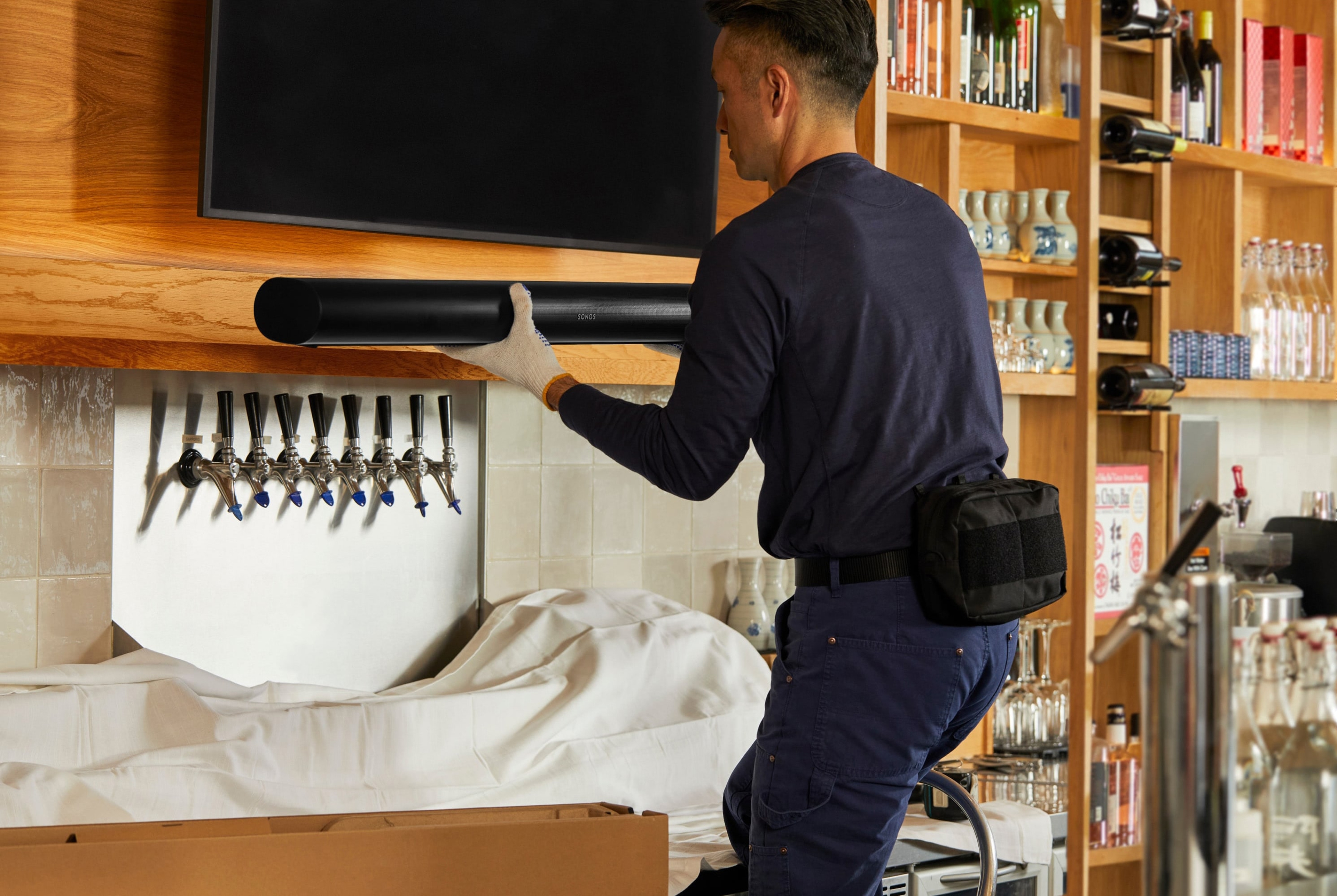 Professional installer installing Sonos Arc