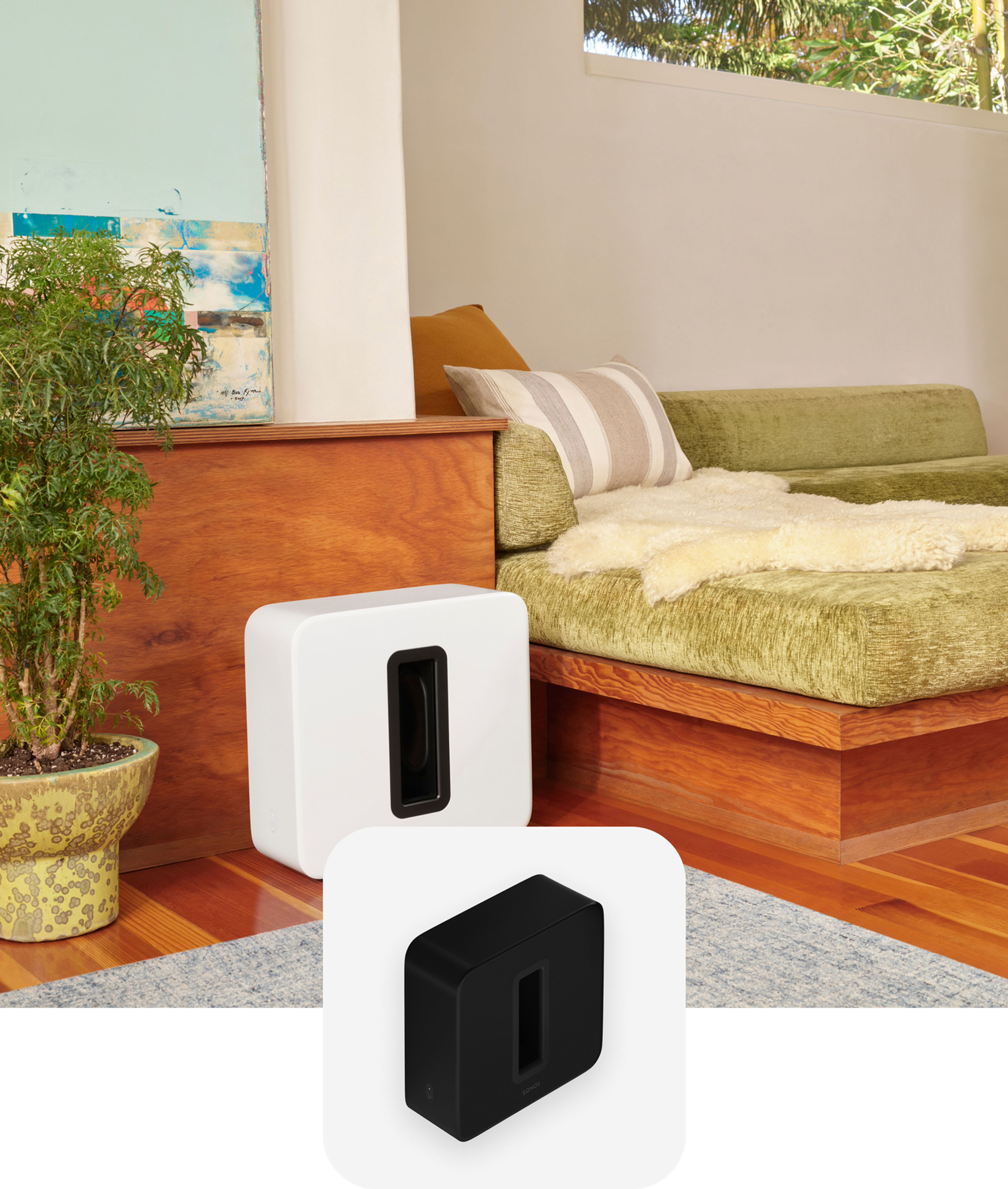 A white Sub (Gen 3) sitting next to a couch with green cushions