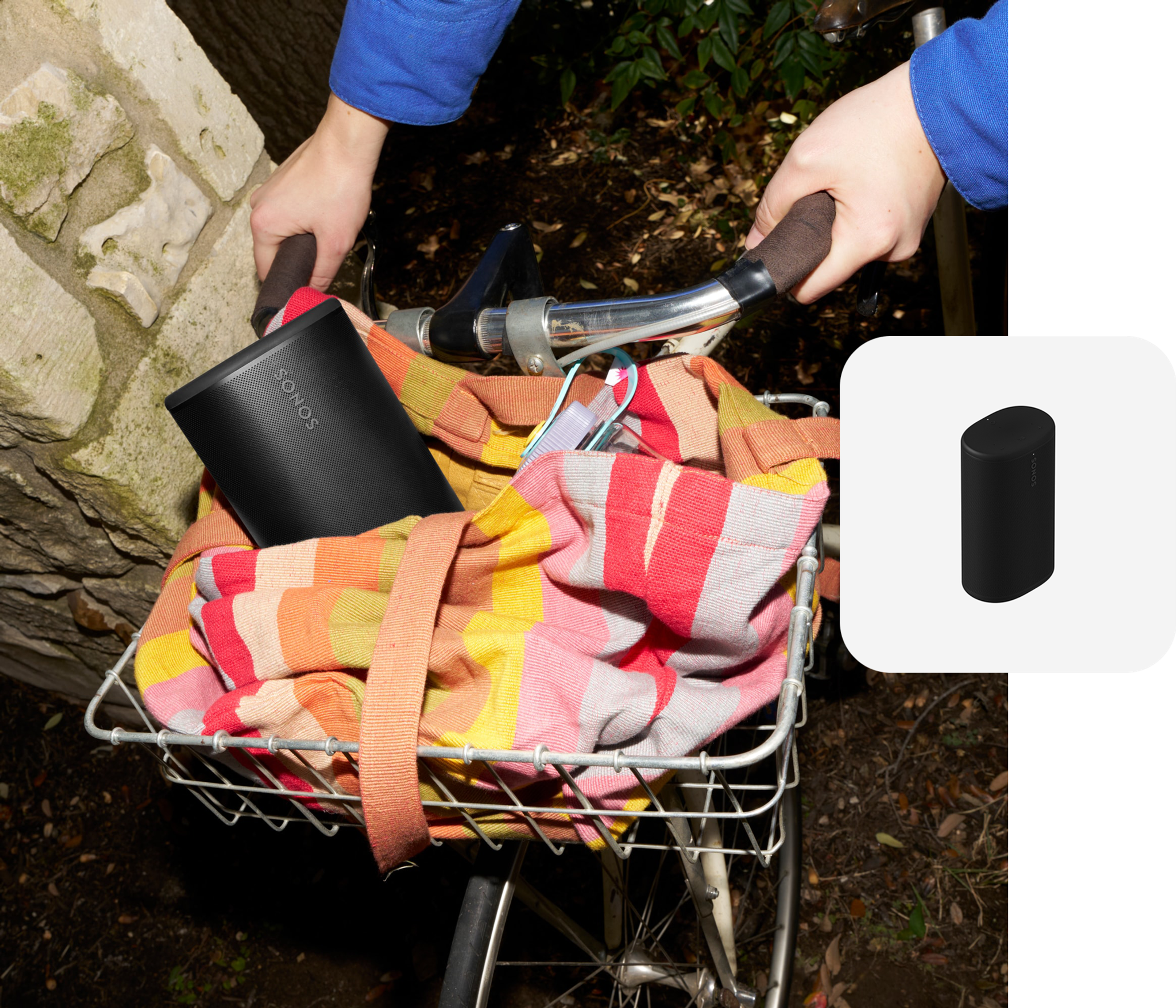 Black Sonos Play speaker placed inside a tote bag in a bicycle basket