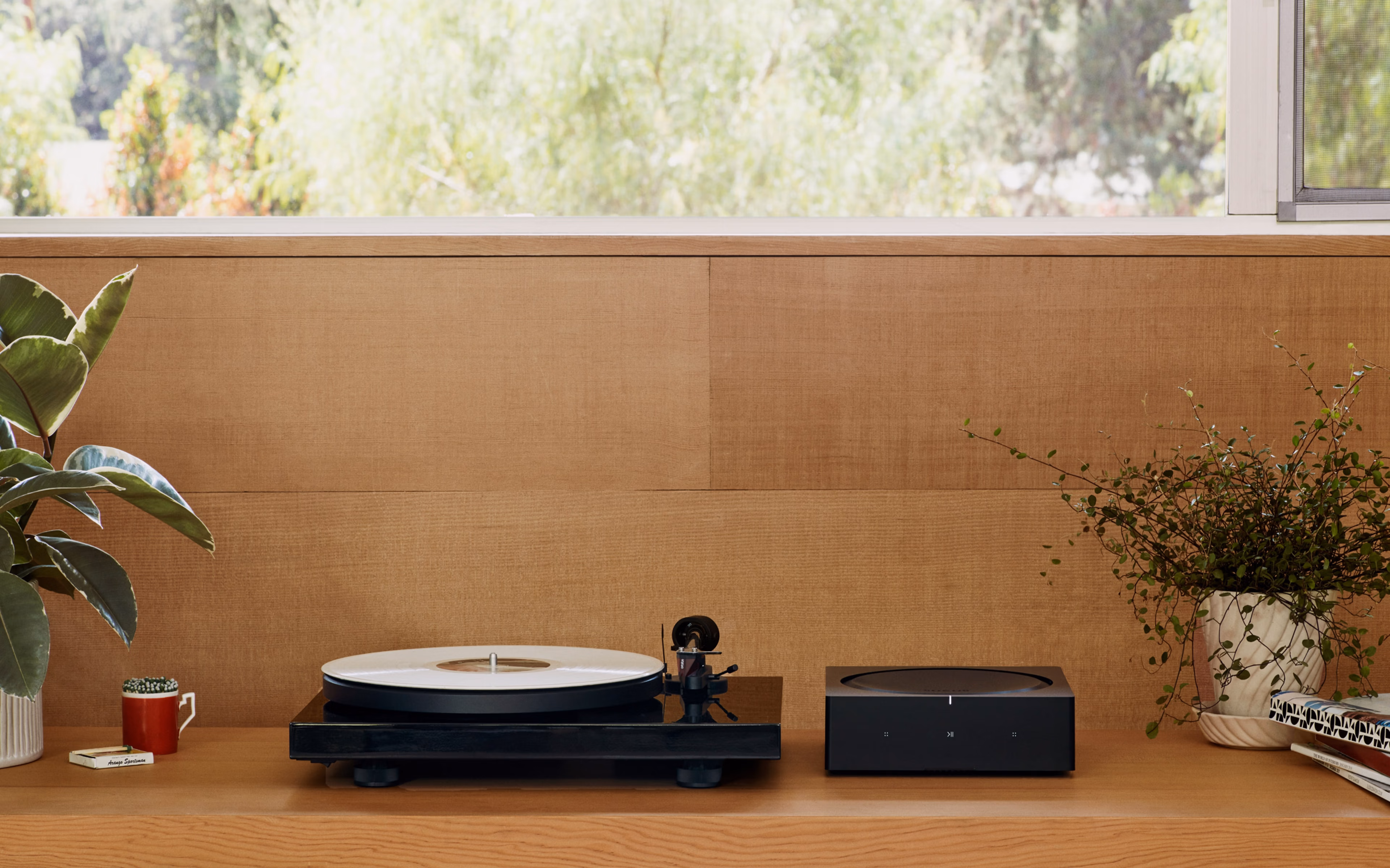 Sonos Amp with turntable on shelf below window