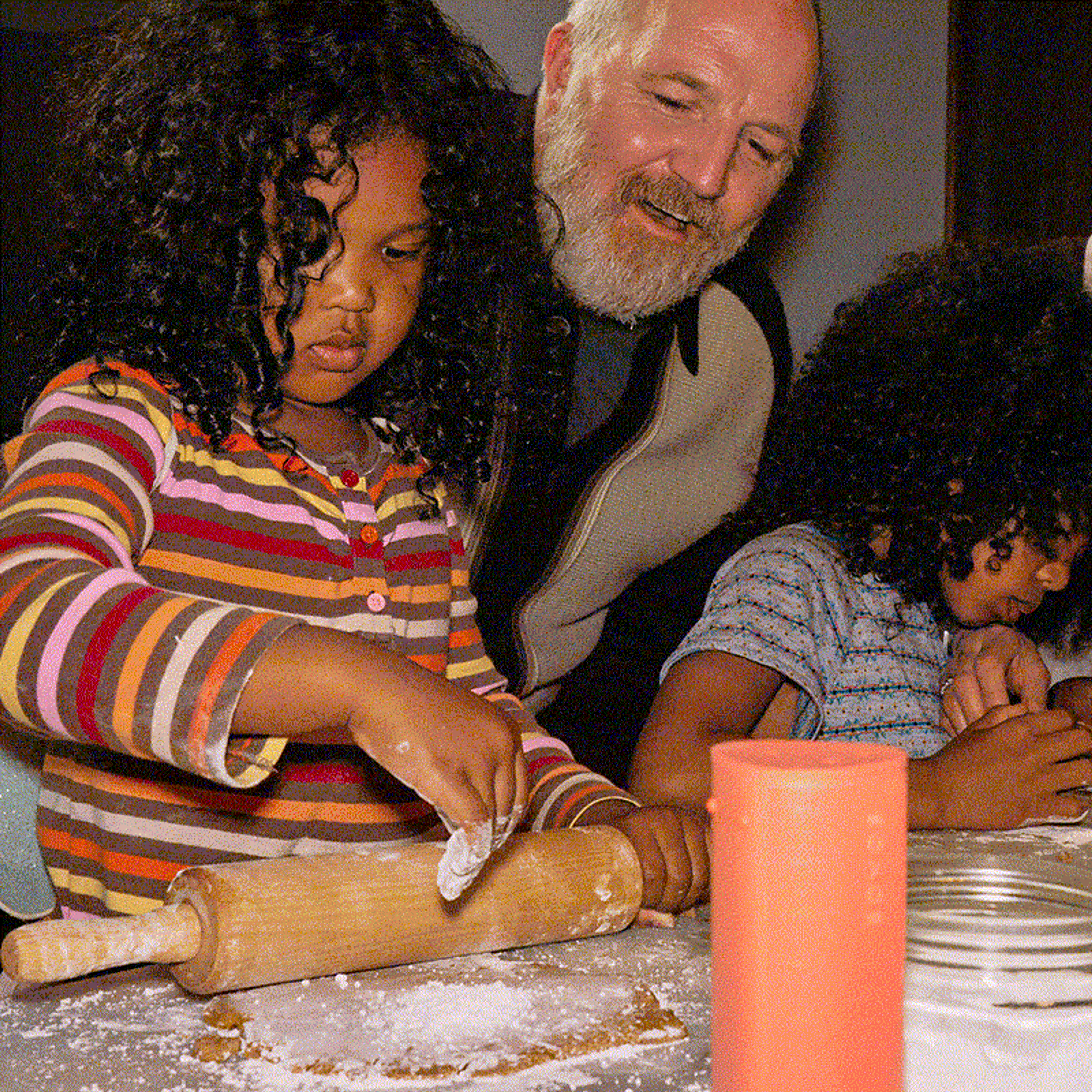 A family baking holiday cookies together