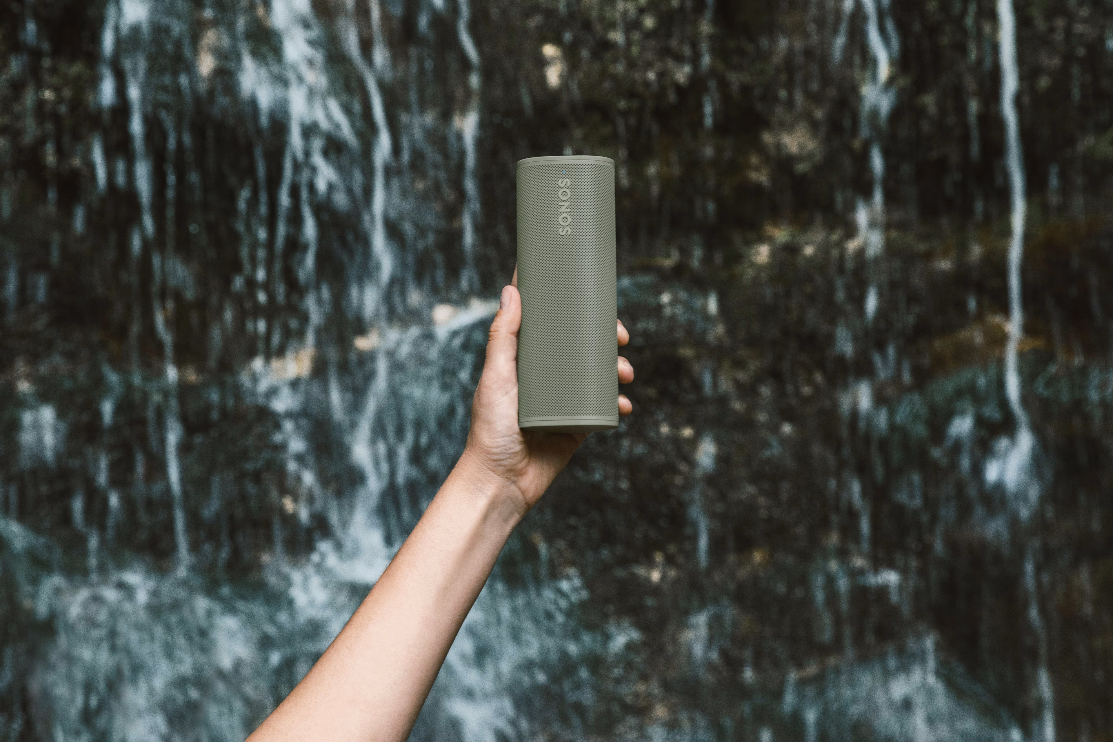 Roam 2 Olive with waterfall background