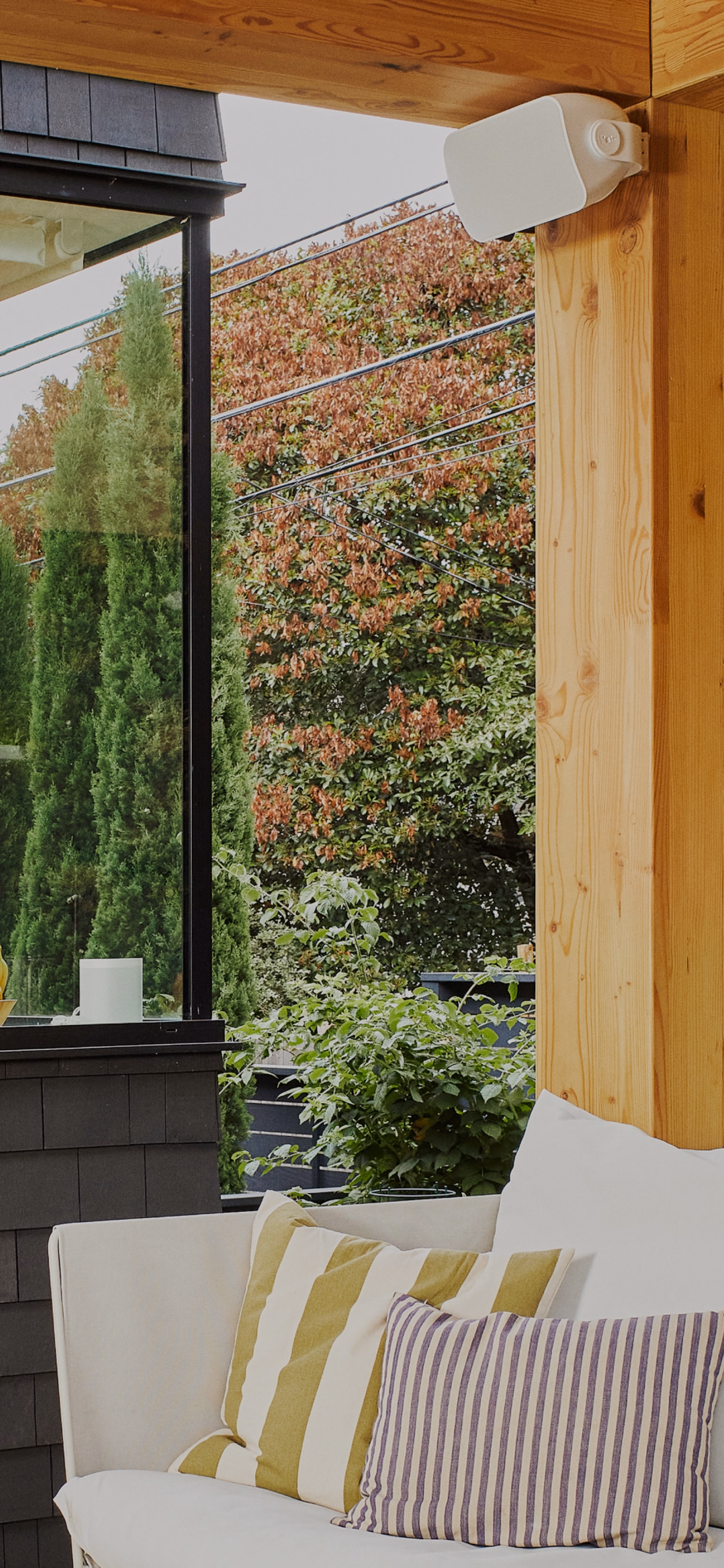 Sonos and Sonance Outdoor speaker installed under awning of outdoor patio