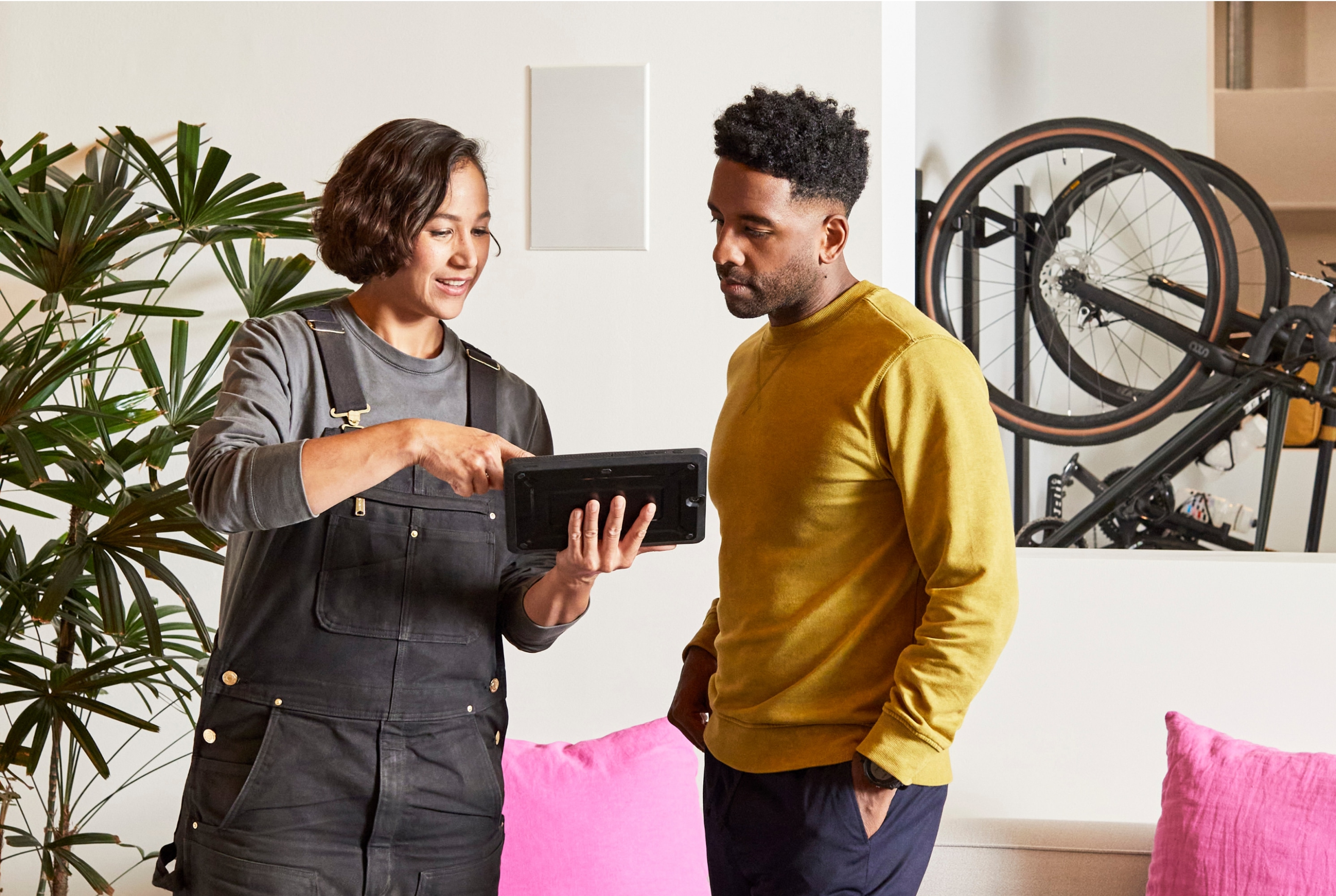 Two people looking at a tablet
